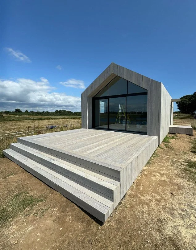 A small out building which we timber framed and clad using fire rated materials and built a matching suspended decking