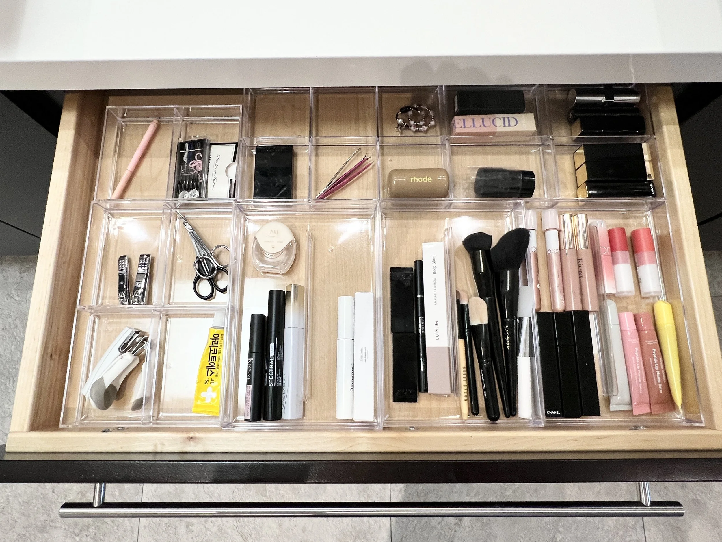 Custom vanity drawer organization in Palos Verdes Estates, California, featuring clear, compartmentalized storage for beauty and personal care essentials. Each item is edited and placed for ease of use, visibility, and daily efficiency, creating a re
