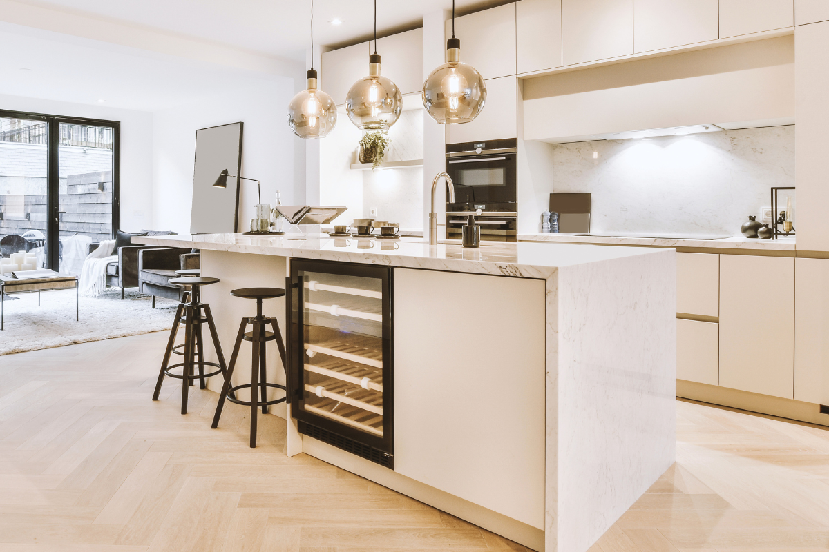 Minimal neutral kitchen with clean surfaces and soft natural light in a calm, organized Los Angeles home