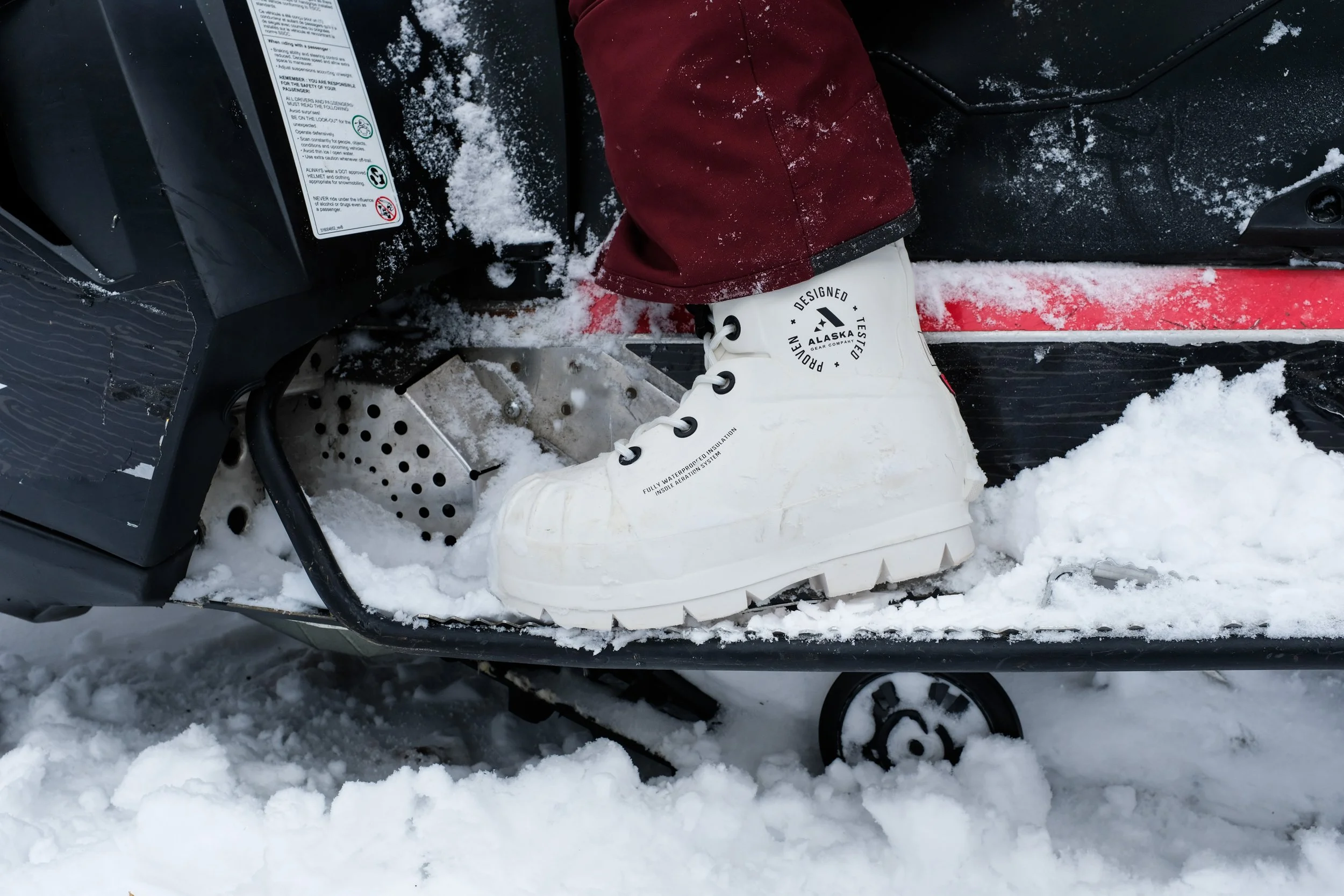 Alaska Gear Company's Bunny Boot close up on a snowmobile.