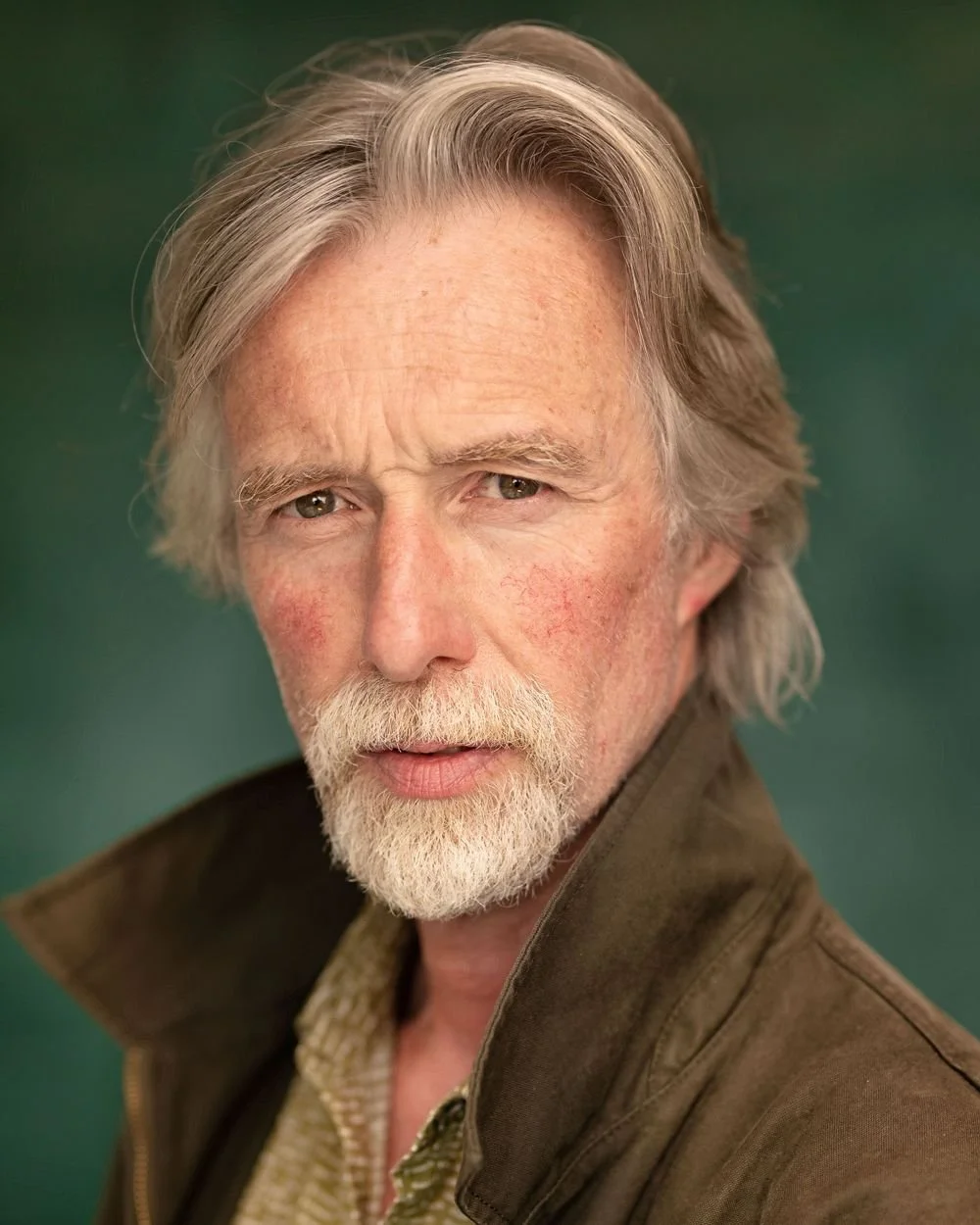 older-male-actor-portrait-green-background.jpg