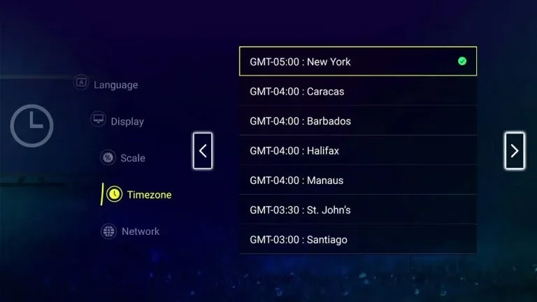 TV or monitor screen displaying timezone settings, with selected time zone: GMT-05:00 for New York, and other listed time zones including Caracas, Barbados, Halifax, Manaus, St. John's, and Santiago.