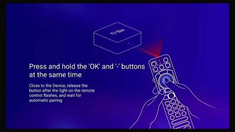 Instructions for pairing a TV box with a remote control by pressing and holding 'OK' and '-' buttons simultaneously