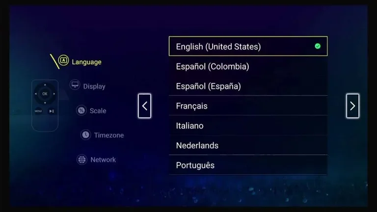 TV screen displaying language options in a menu, with English (United States) selected. Other options include Spanish (Colombia), Spanish (Spain), French, Italian, Dutch, and Portuguese.