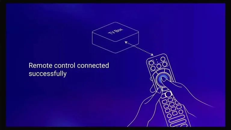 Illustration showing a hand holding a remote control connected to a TV box with a dotted line, indicating successful connection, with text 'Remote control connected successfully'.