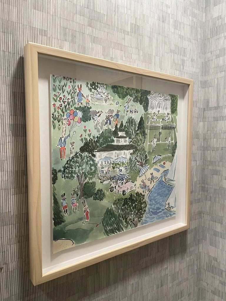 Framed whimsical illustration of a park scene with animals having a picnic, sailing, playing music, and holding balloons.