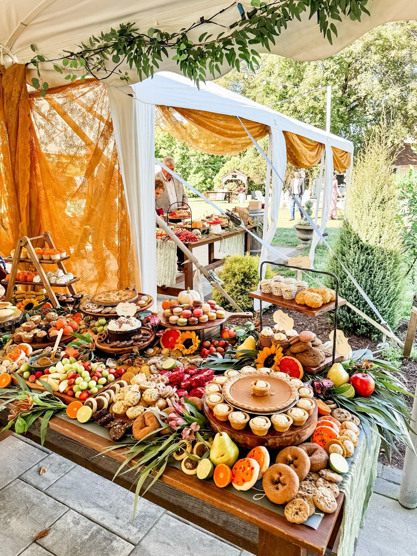 Fall weddings done right 🍂✨ A harvest-inspired charcuterie table for cocktail hour, followed by a cozy dessert graze of pumpkin pies, donuts, and sweets galore. Two spreads, one seamless experience &mdash; like the seasons changing in a single night