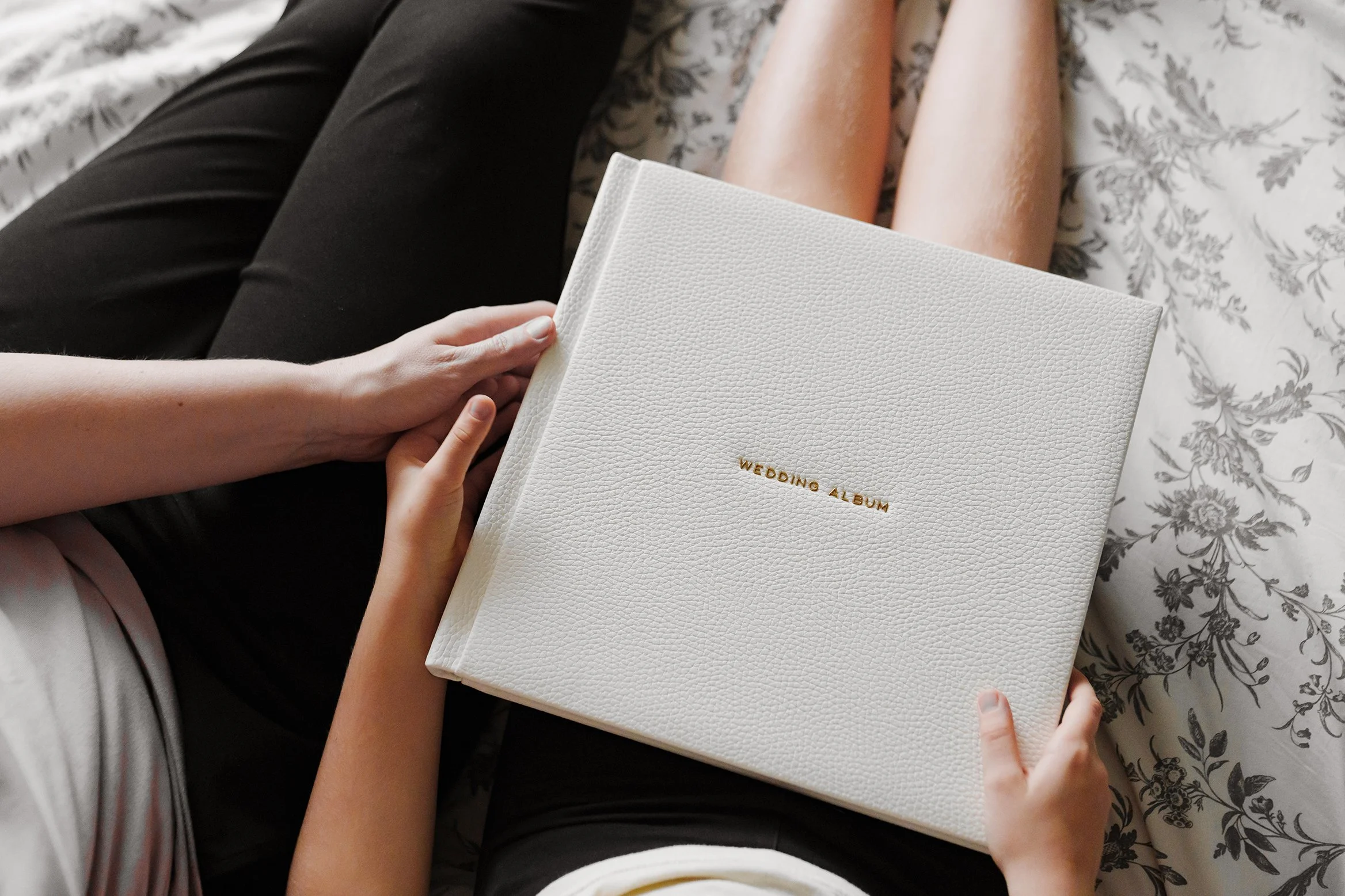 Laurie’s customers, Fernando and Kate embracing by the lake on their wedding day.