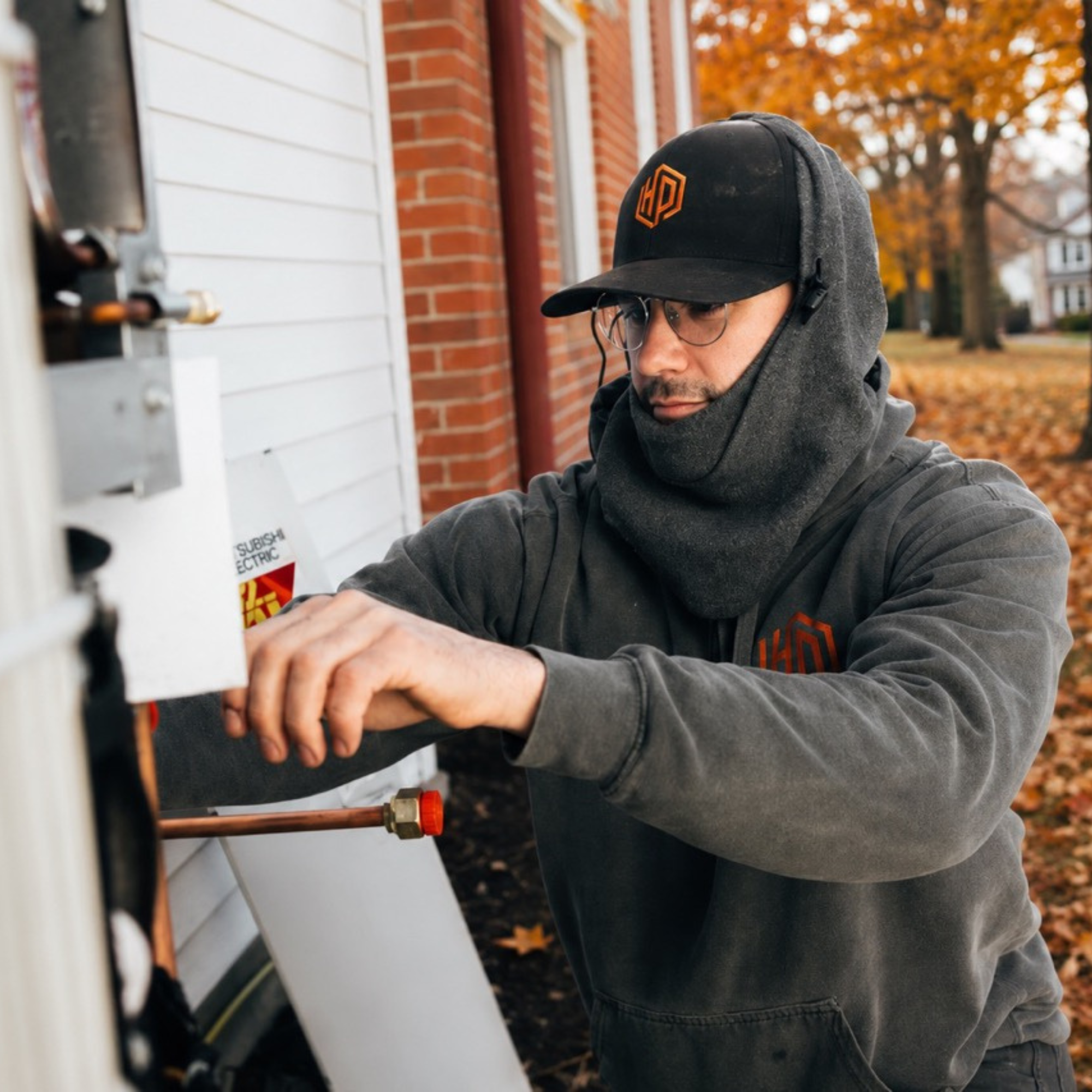 Only Heat Pumps technician performing preventative maintenance on a heat pump in Maine