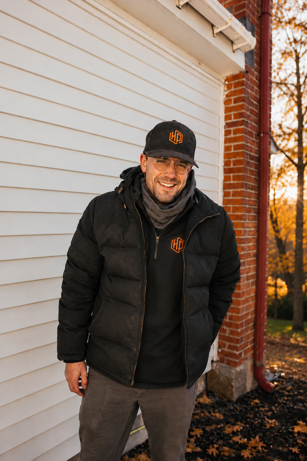 Professional Only Heat Pumps technician outside a Southern Maine home, providing expert heat pump installation and service.