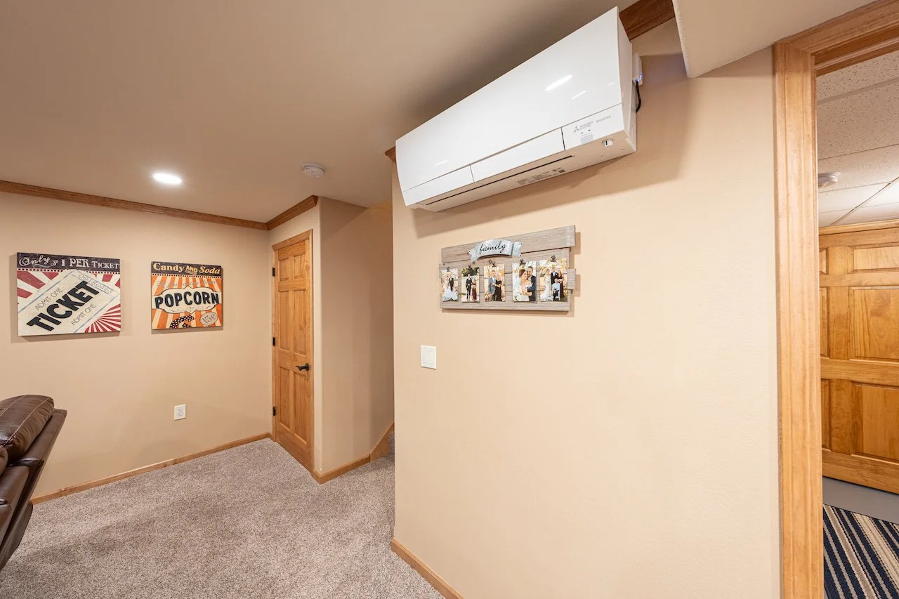 Wall-mounted ductless mini-split heat pump providing heating inside a Southern Maine home.