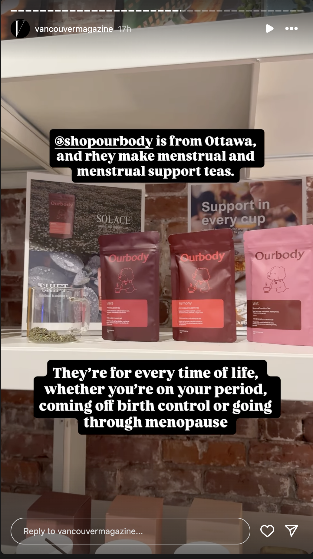 Display of Ourbody menstrual and support teas on a shelf with product packaging in red and pink, informational posters in the background, and a glass cup with loose tea leaves.
