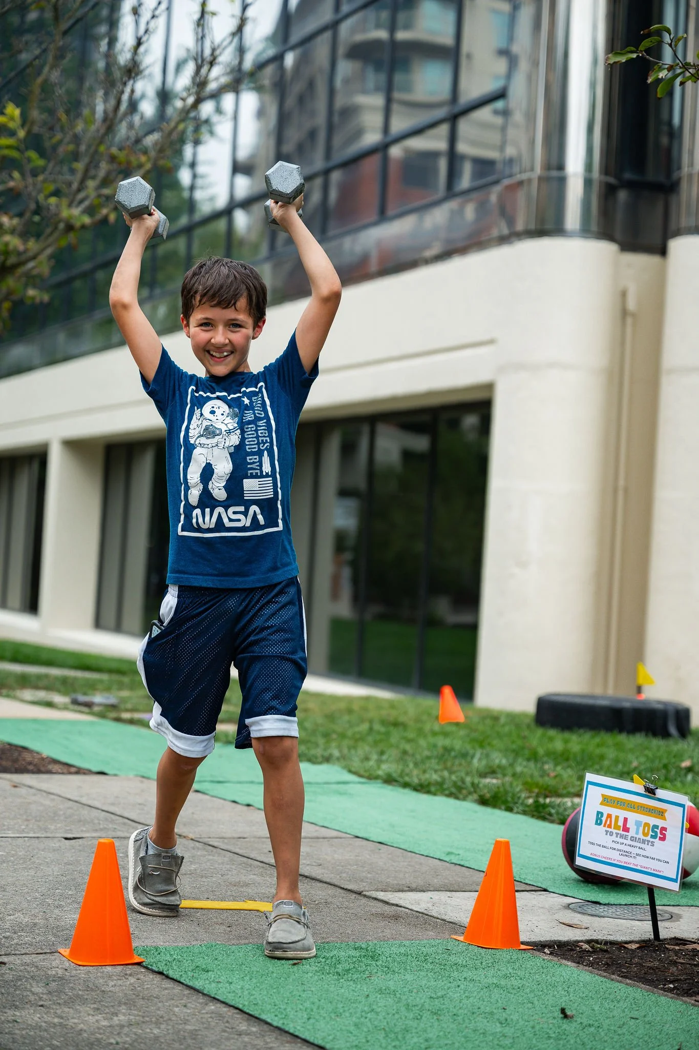 Young man lifting weights at Strongfest