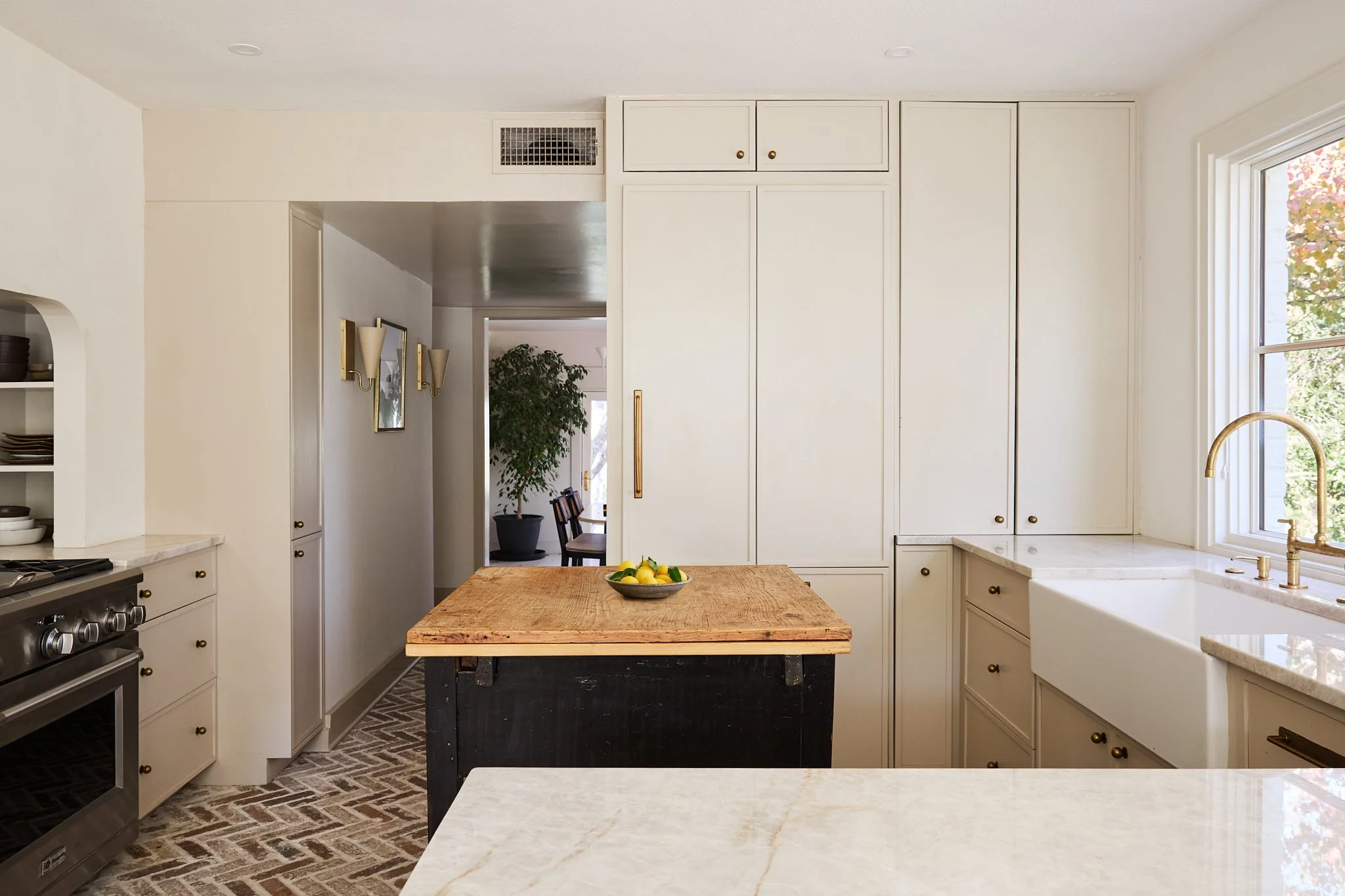 This custom kitchen cabinetry project blends classic proportions with thoughtful modern detailing to create a space that feels warm, functional, and timeless. Designed and built specifically for the home, the cabinetry maximizes storage while maintai