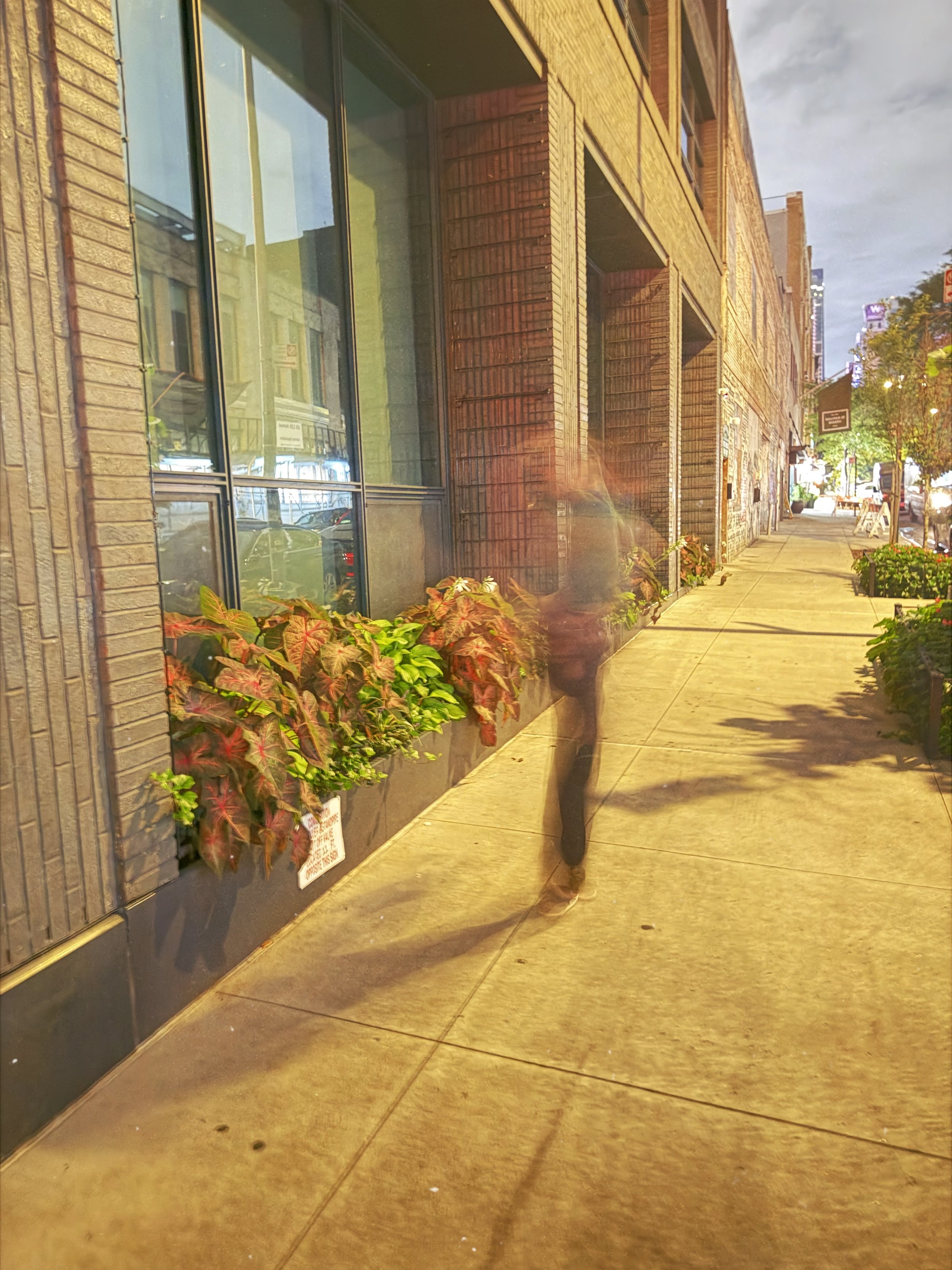 a long exposure, stylistic image of a man mid attitude spin.