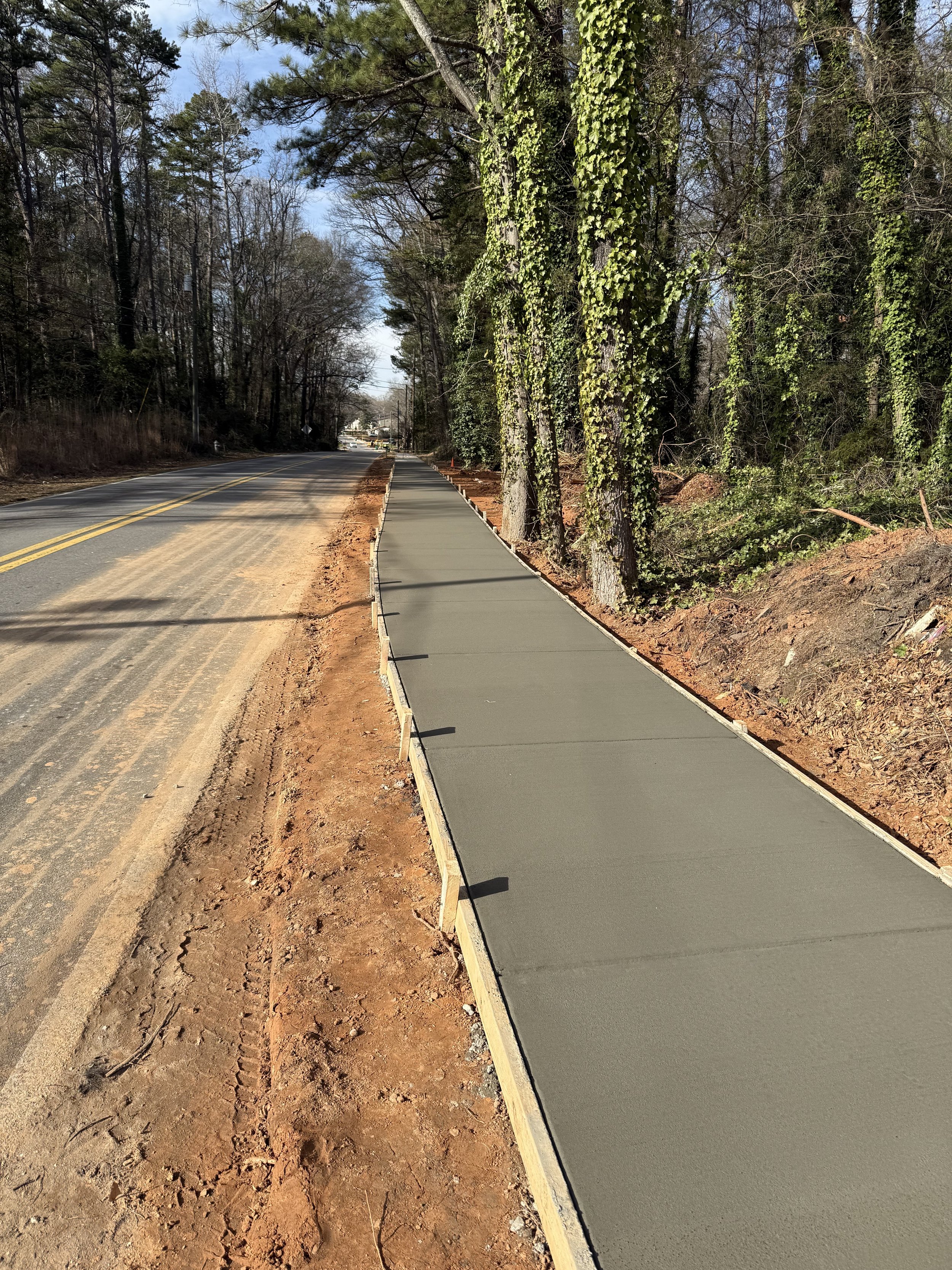 Undone sidewalk by Priority Paving Construction Solutions