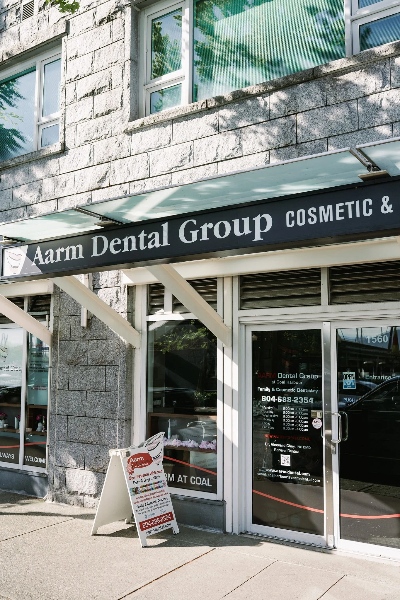 Aarm Dental Group clinic exterior at Coal Harbour, accepting new patients for affordable cosmetic and emergency dental care. We provide family & cosmetic dentistry without charging above the BCDA fee guide.