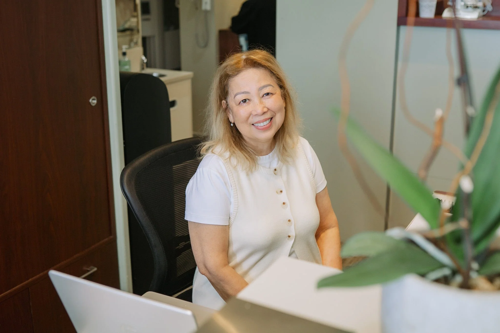Welcoming front desk team at Aarm Dental at Coal Harbour, helping patients navigate insurance and the Canadian Dental Care Plan (CDCP) with direct billing and transparency. Affordable, patient-first dental care starts here.