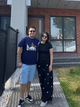 Couple standing in front of their new home in Oak Park, Melbourne