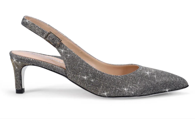 Silver sparkly slingback high heel with pointed toe, styled as a timeless fashion statement shoe.