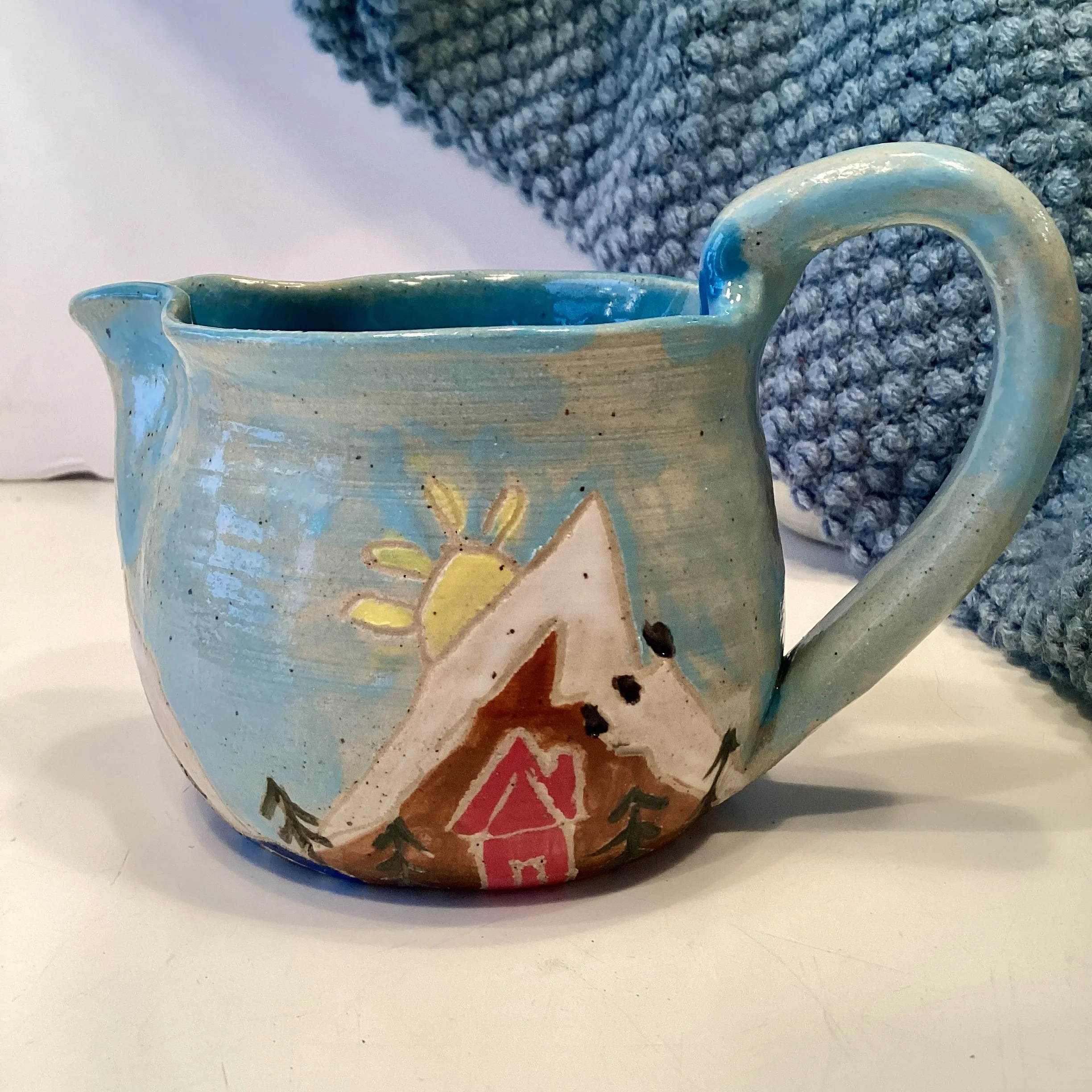 Cabin in the mountains creamer