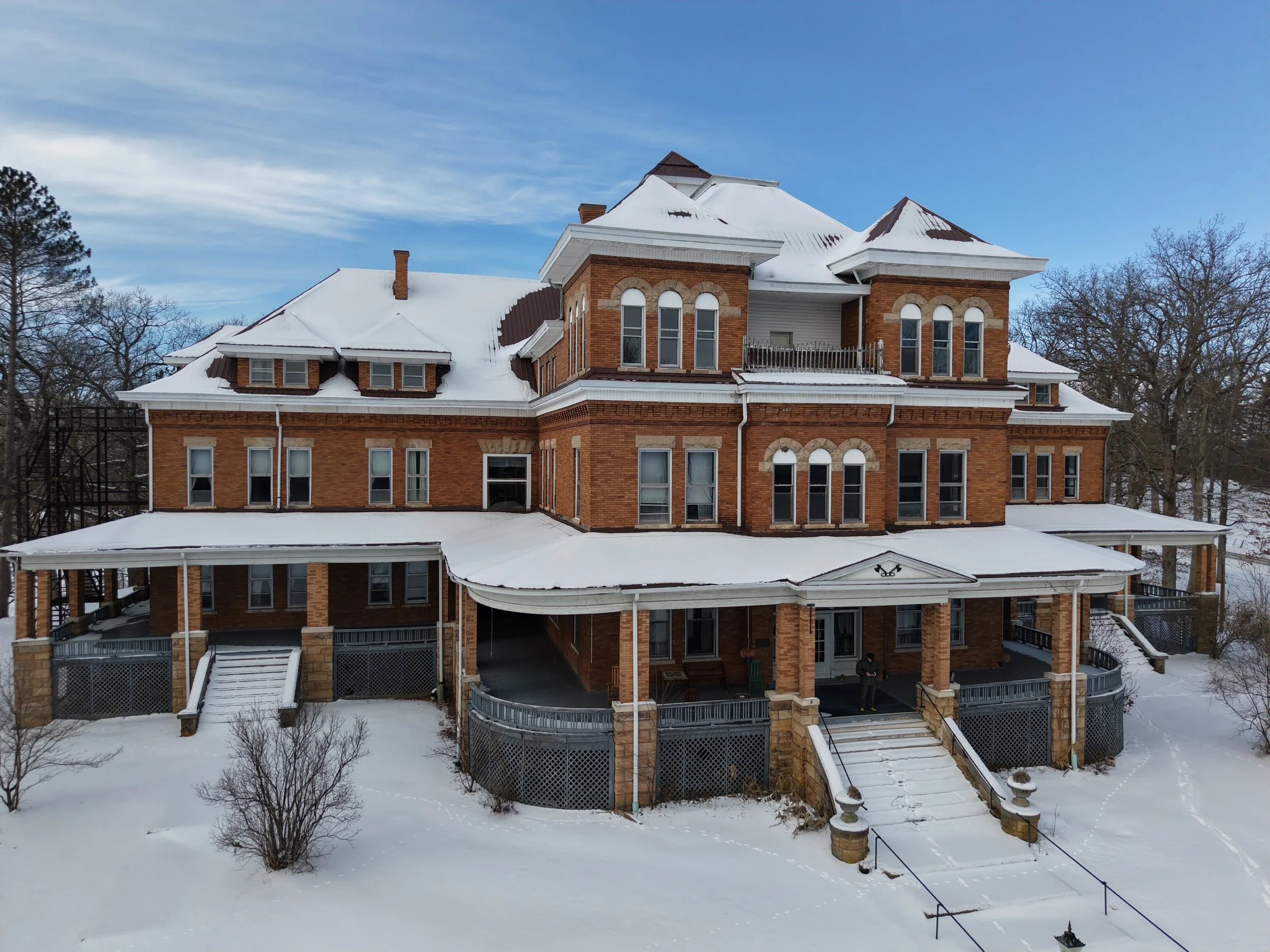 A snowy porch shot of the oddfellow manor of elkins WV