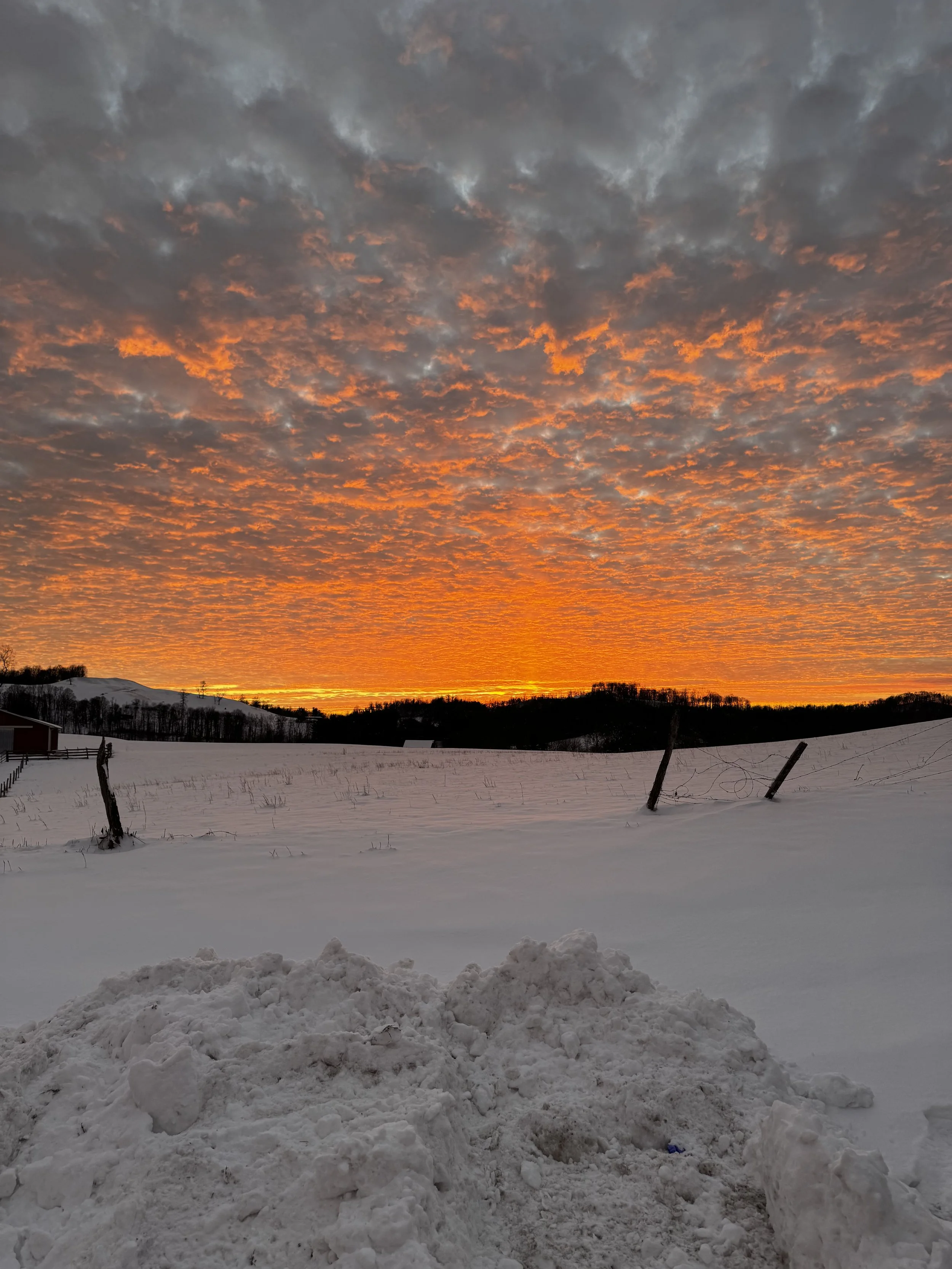 a snowy sunset at the oddfellow manor in elkins wv