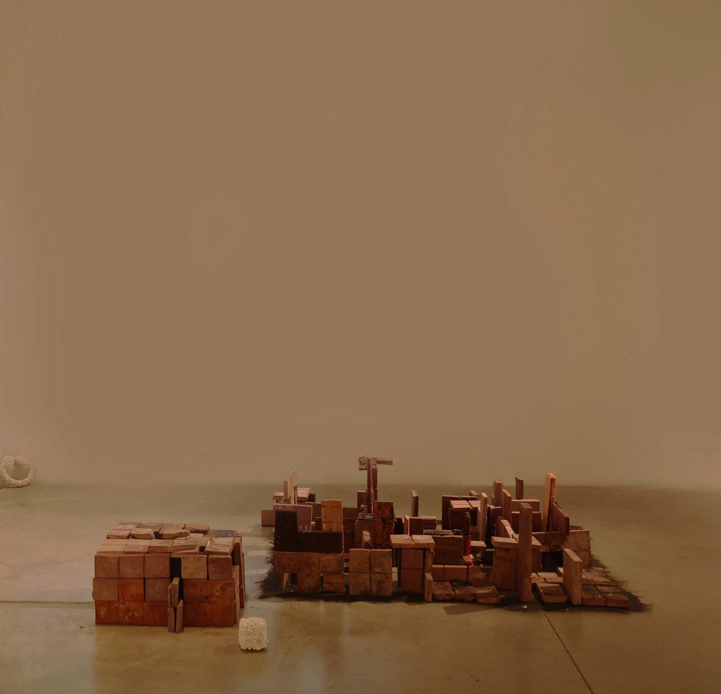 Zitz, Oil, Jolts, Soil, concrete, wax, glass, black sand, hair, and steel, 2025