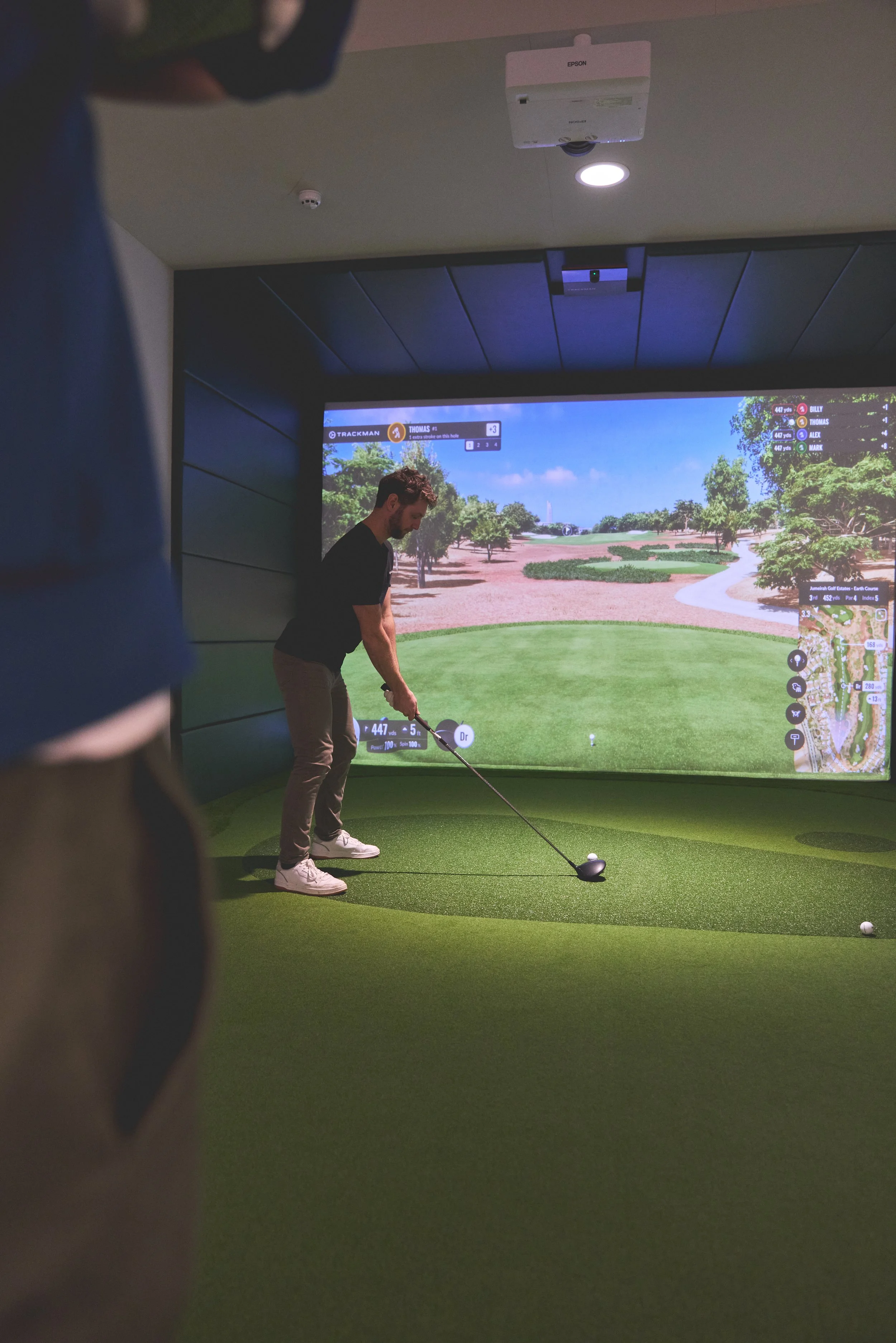 golfer in an indoor simulator