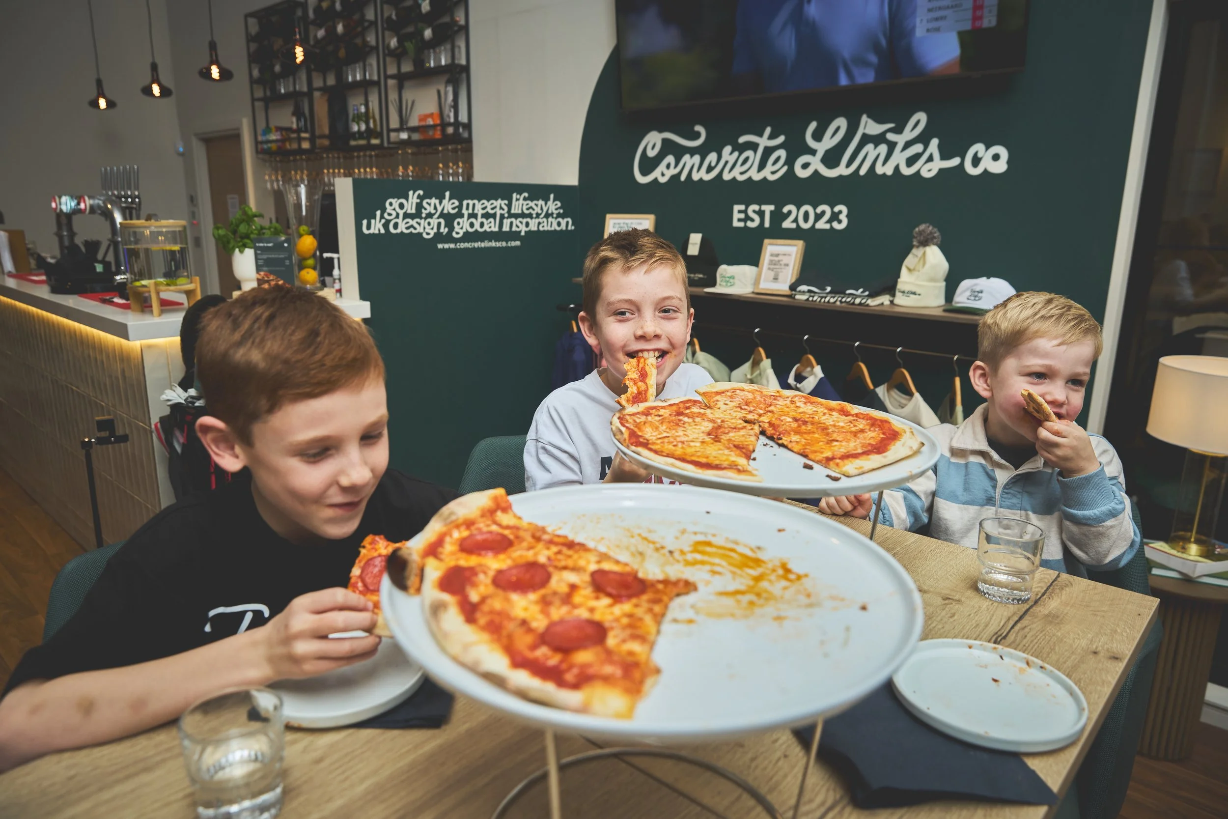 Kids eating pizza at their birthday party