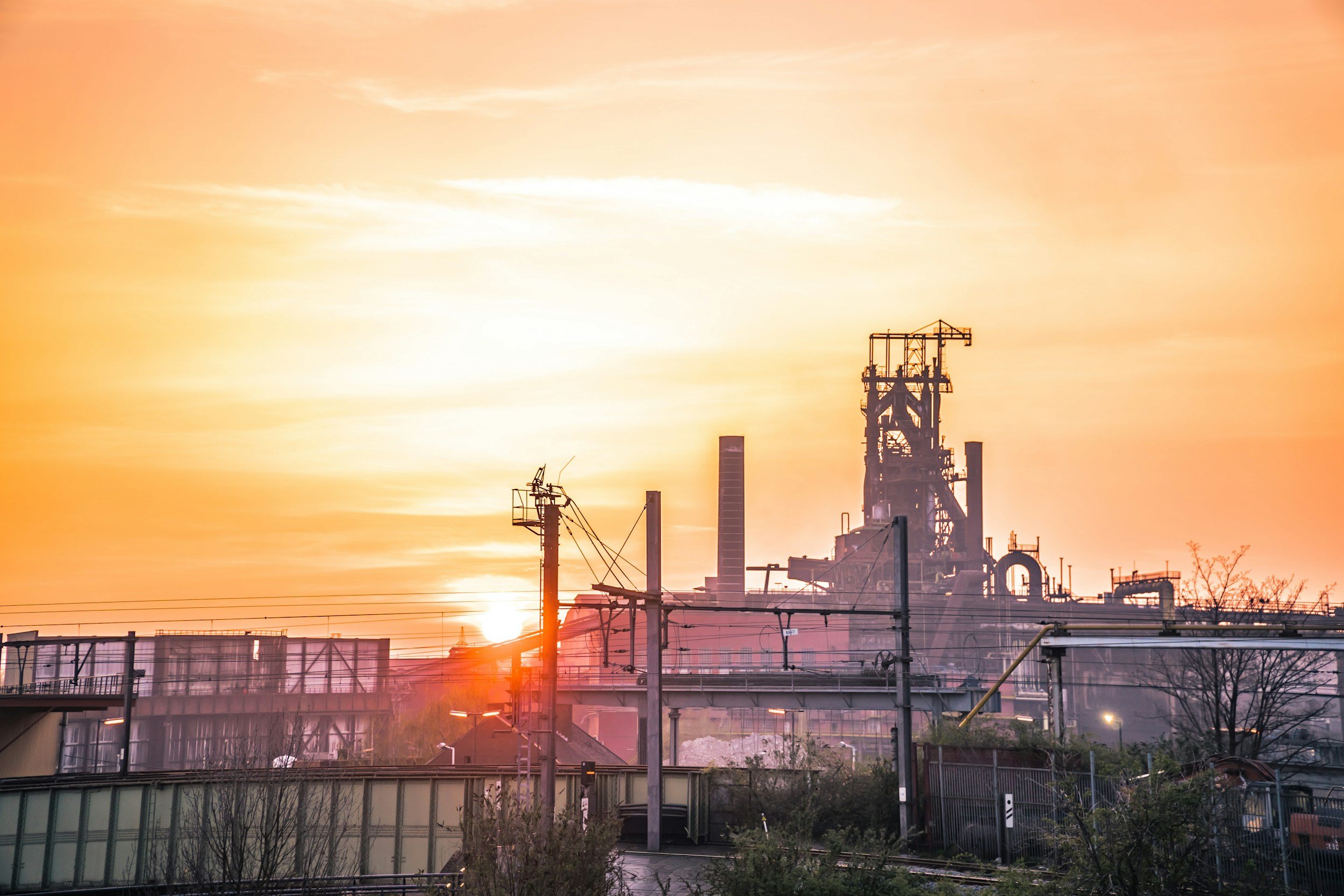 Image of industrial site with sun