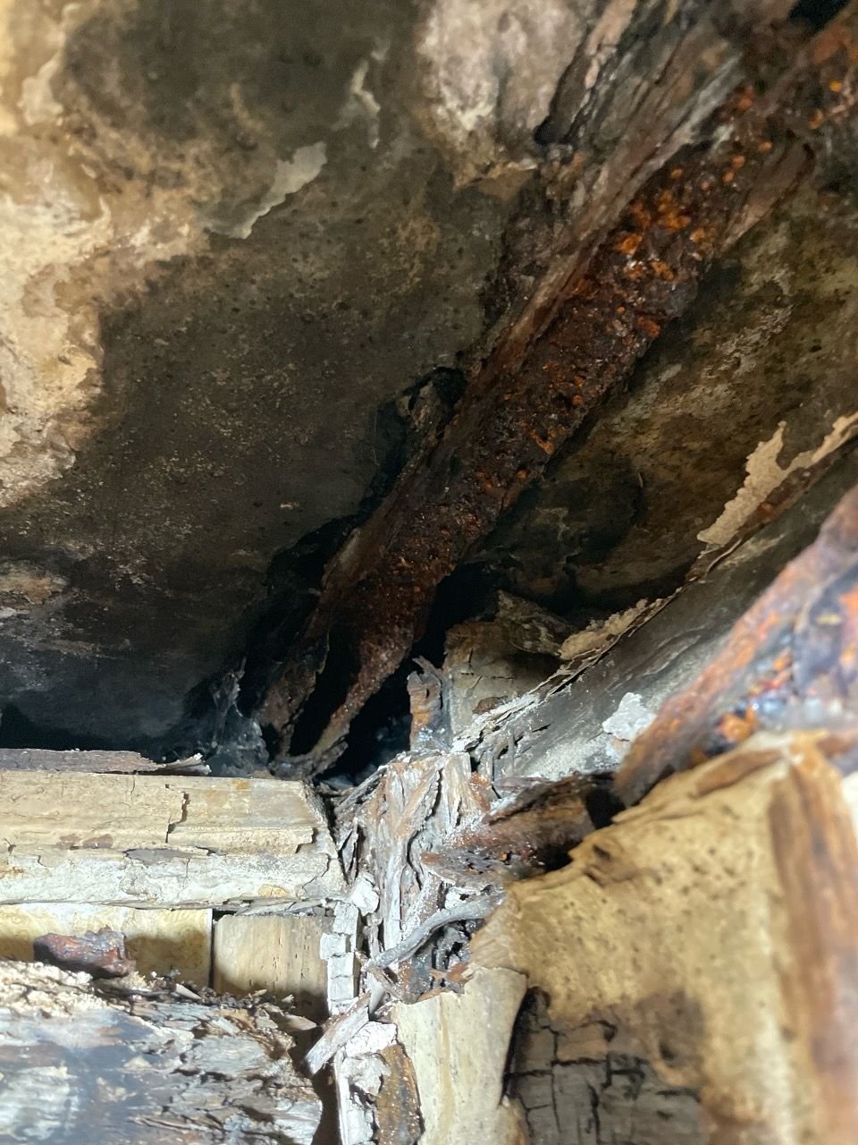 Heavily corroded open cast pipe