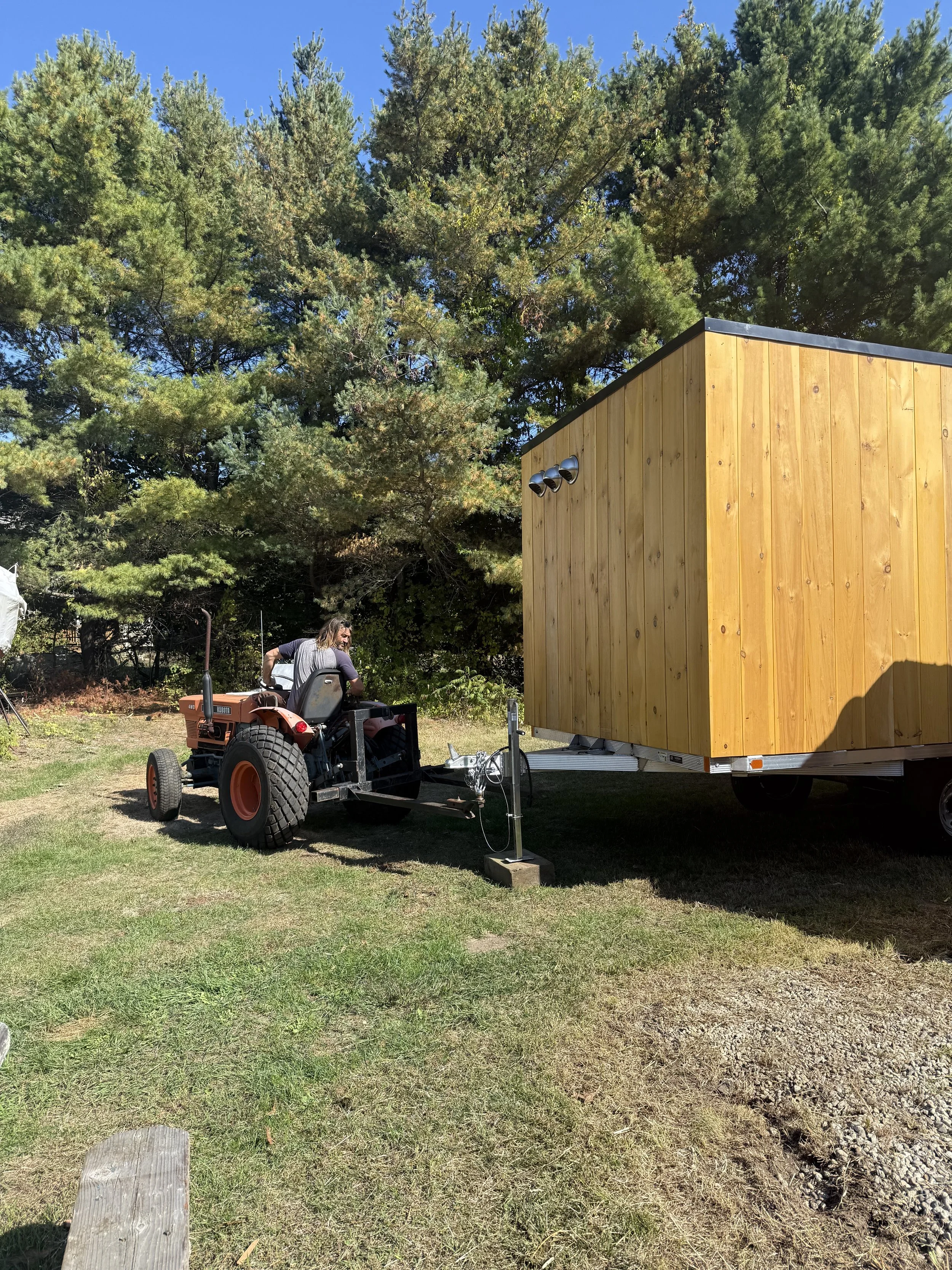 Owner of Black Point Surf Shop putting Rove Sauna in position in Scarborough Maine
