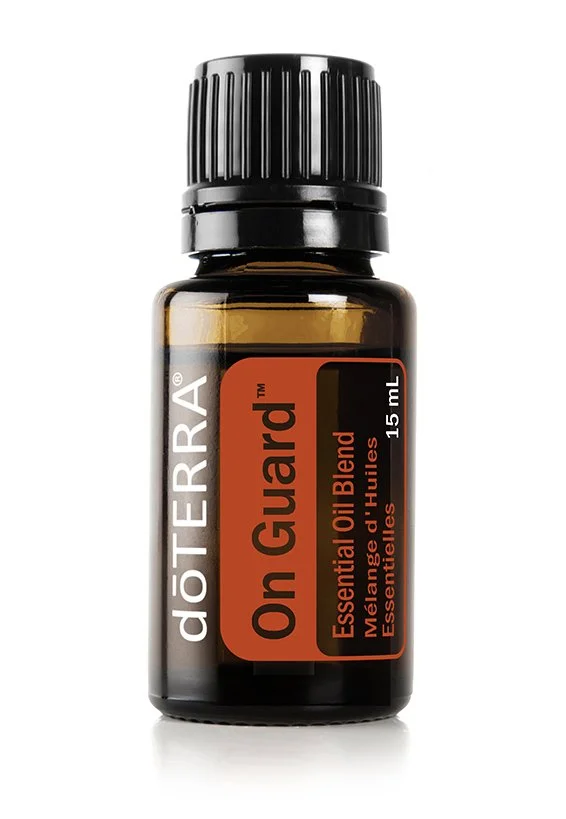 dōTERRA On Guard essential oil blend 15 mL bottle with black cap and orange label.