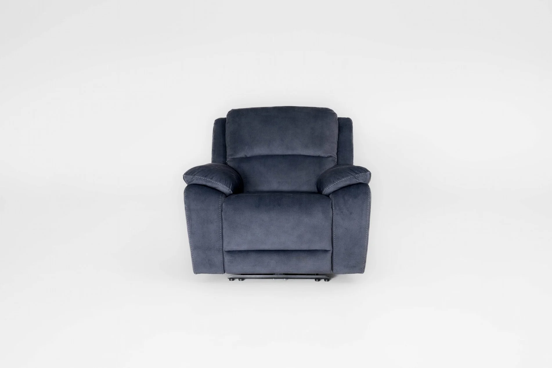 A single dark blue plush armchair on a white background.