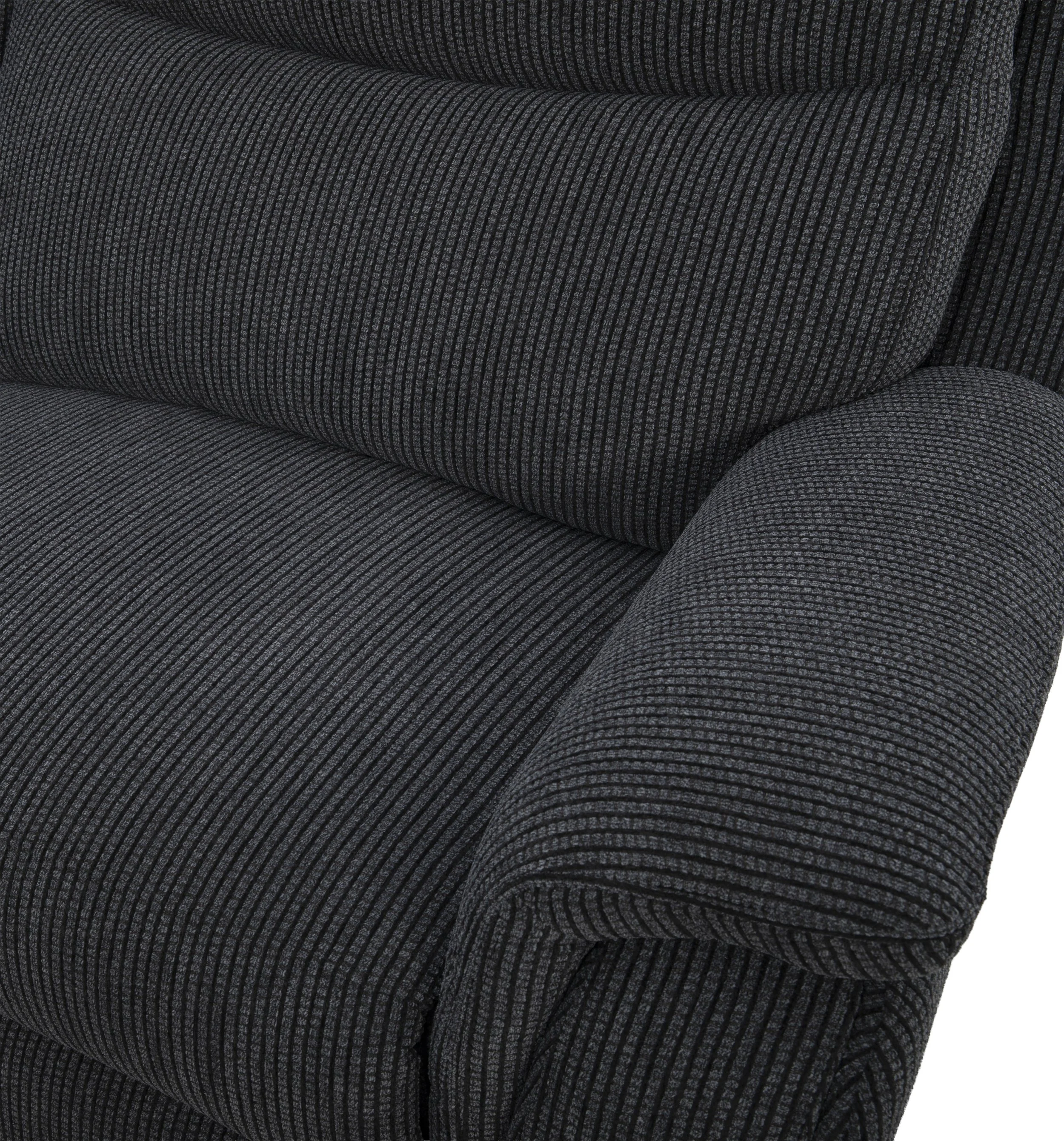 Close-up of a dark gray upholstered armchair with vertical striped pattern fabric.