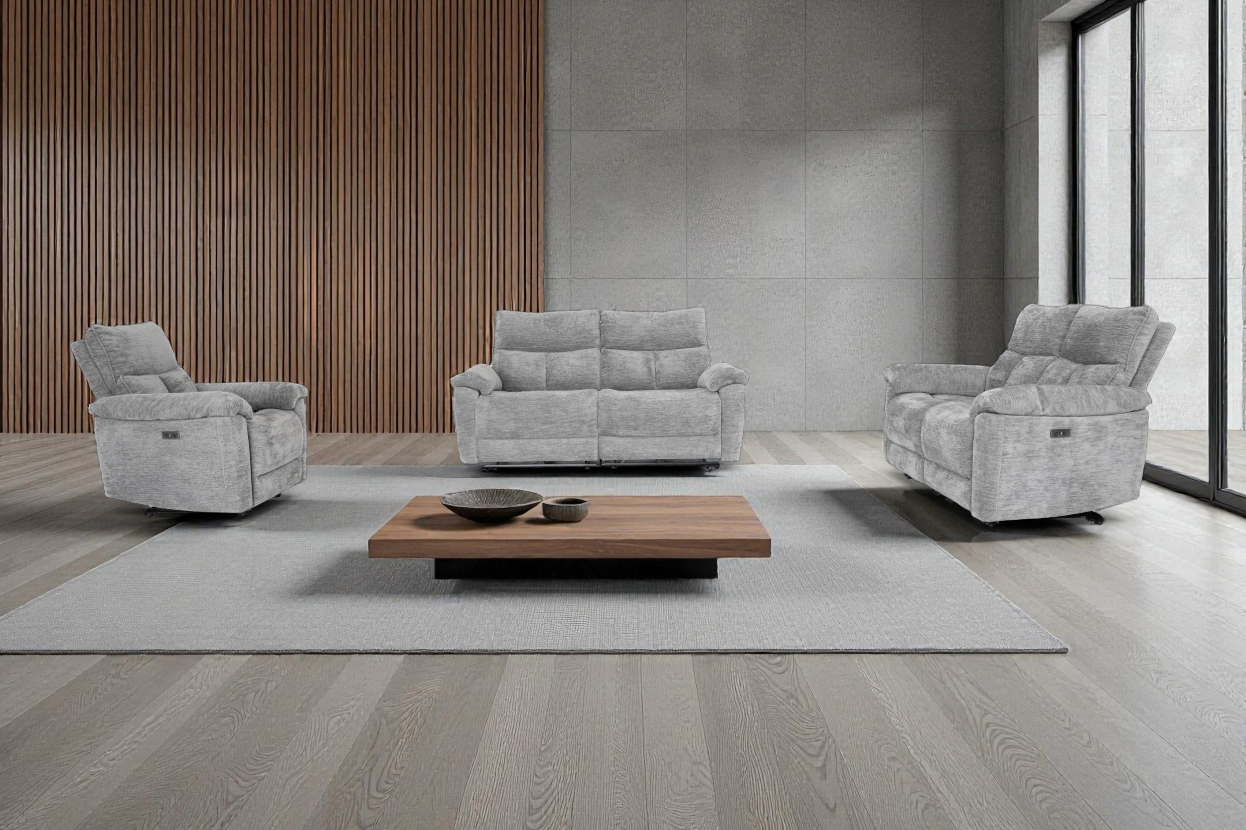 Three gray upholstered living room sofas with plush cushions and armrests, arranged against a plain white background.