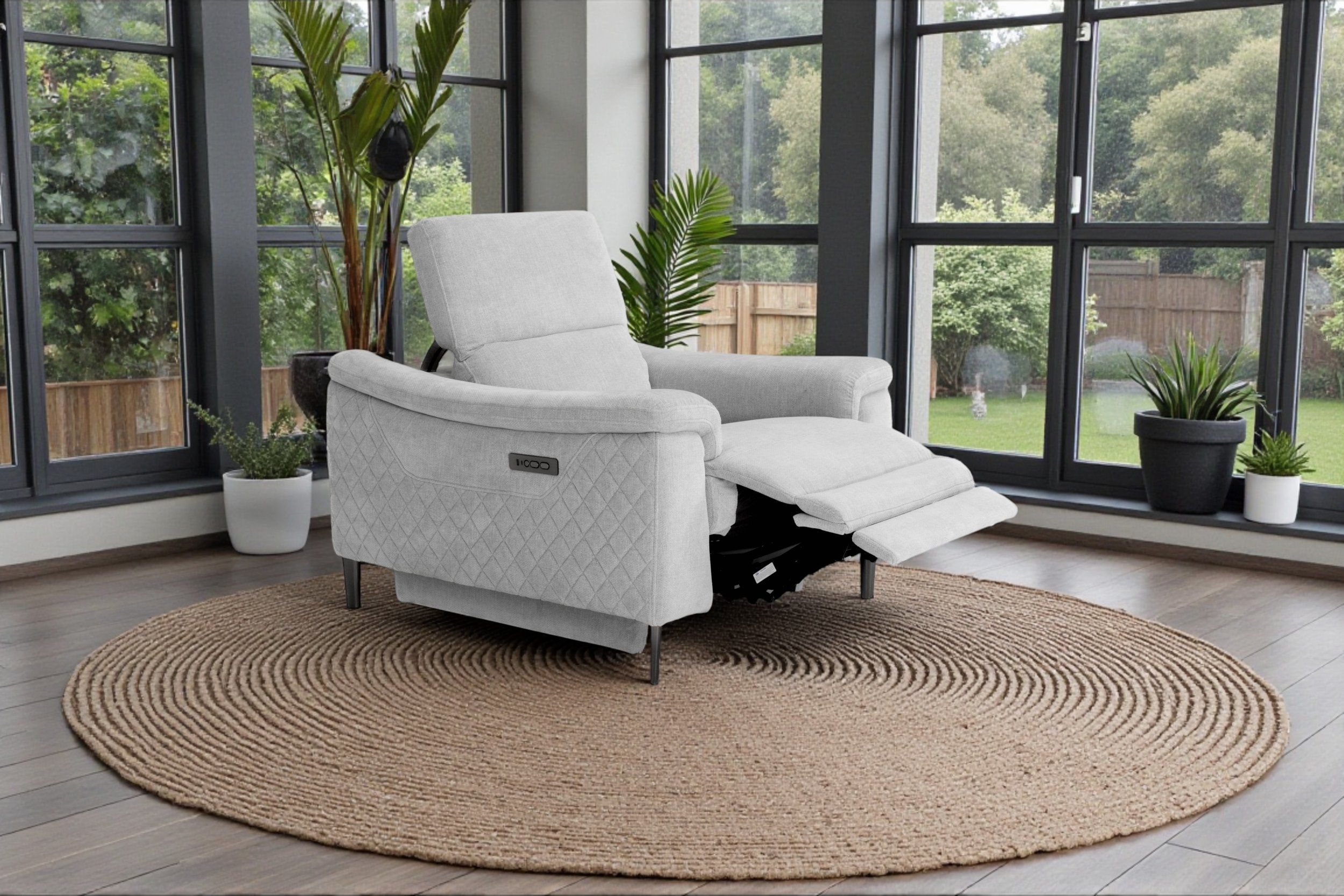 A light gray upholstered armchair with dark wooden legs against a white background.