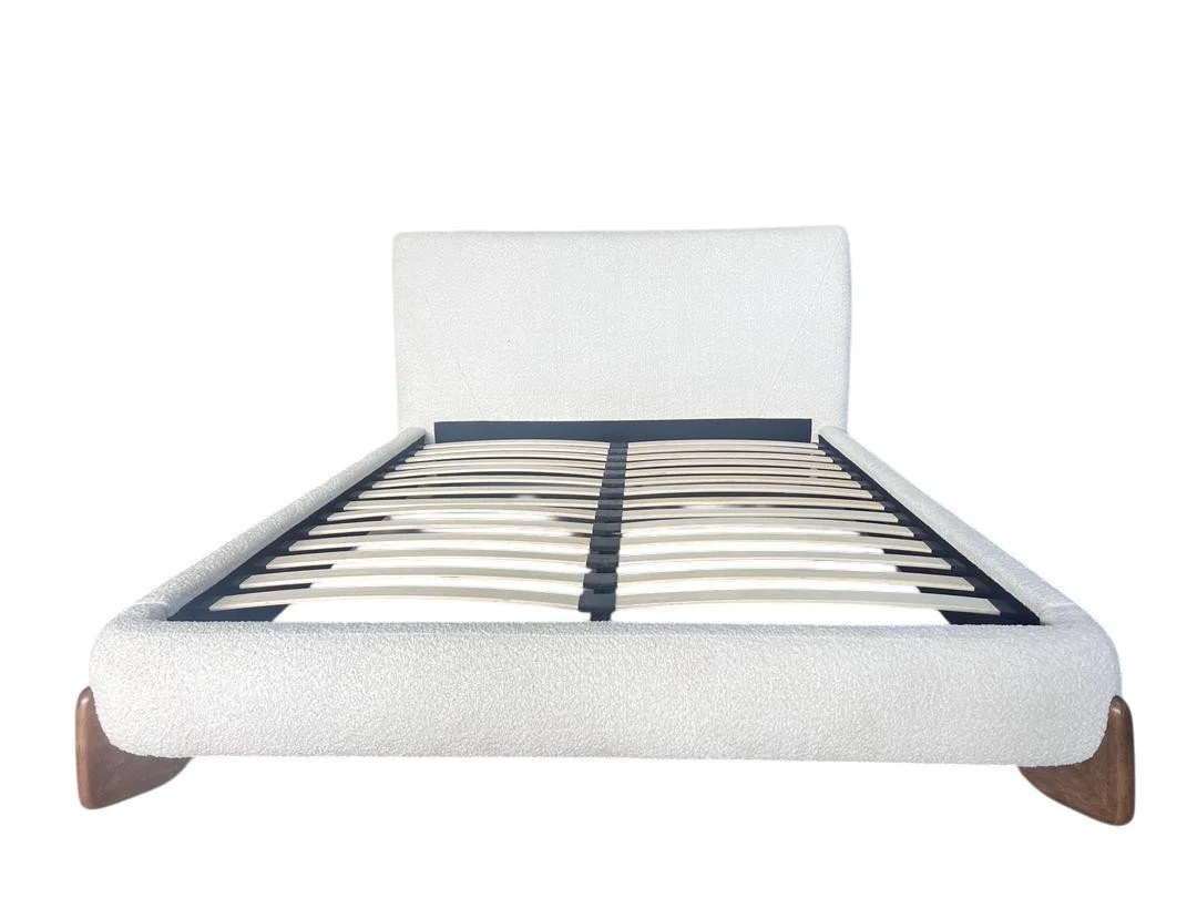 White bed frame with a headboard and wooden legs, showing a mattress and bed slats, isolated on a white background.