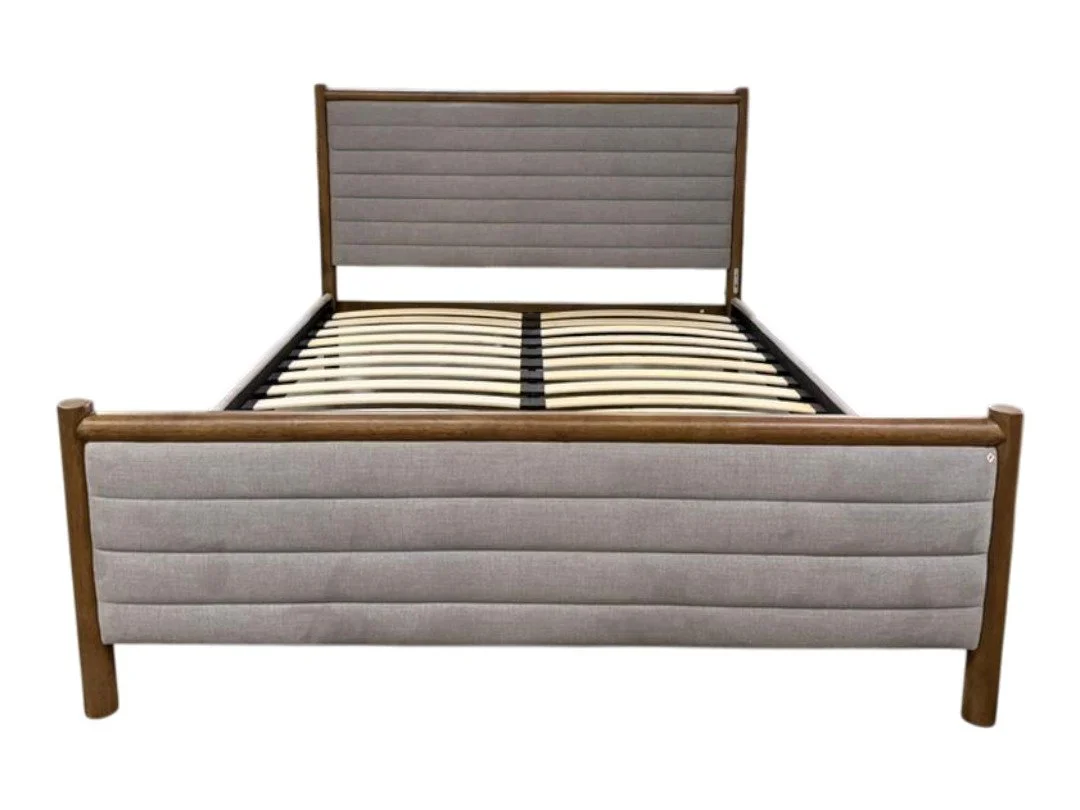 A wooden bed frame with a padded headboard and footboard, and a mattress support with wooden slats.