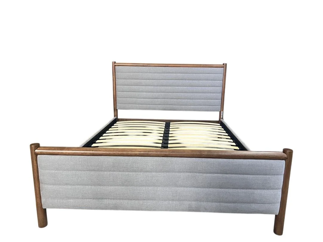 A modern bed frame with light gray upholstered headboard and footboard, wooden side rails, and a slatted base.
