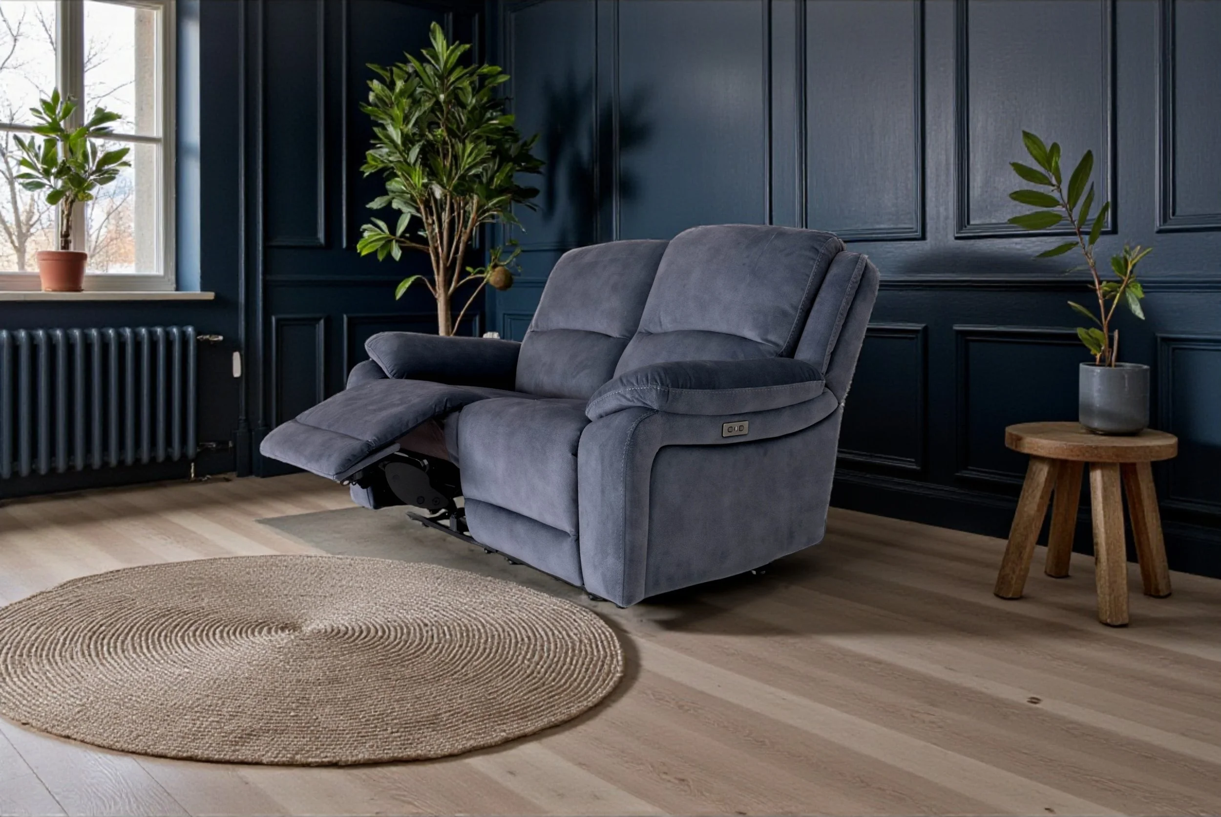 A dark blue two-seater sofa against a plain white background.