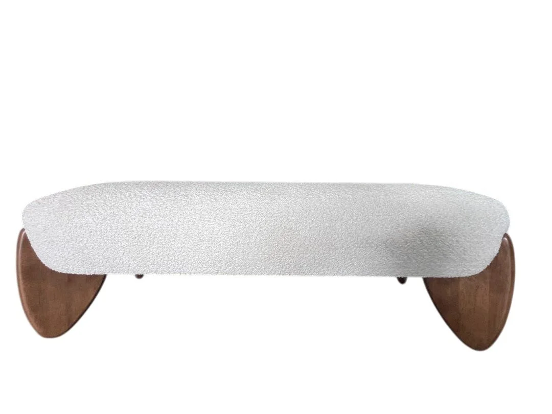 Minimalist bench with a textured white cushion and curved wooden legs