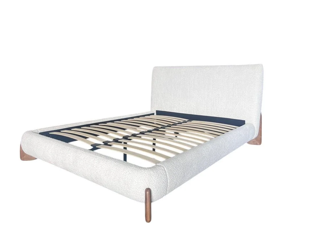 A white upholstered bed frame with a headboard, wooden legs, and a slatted base.