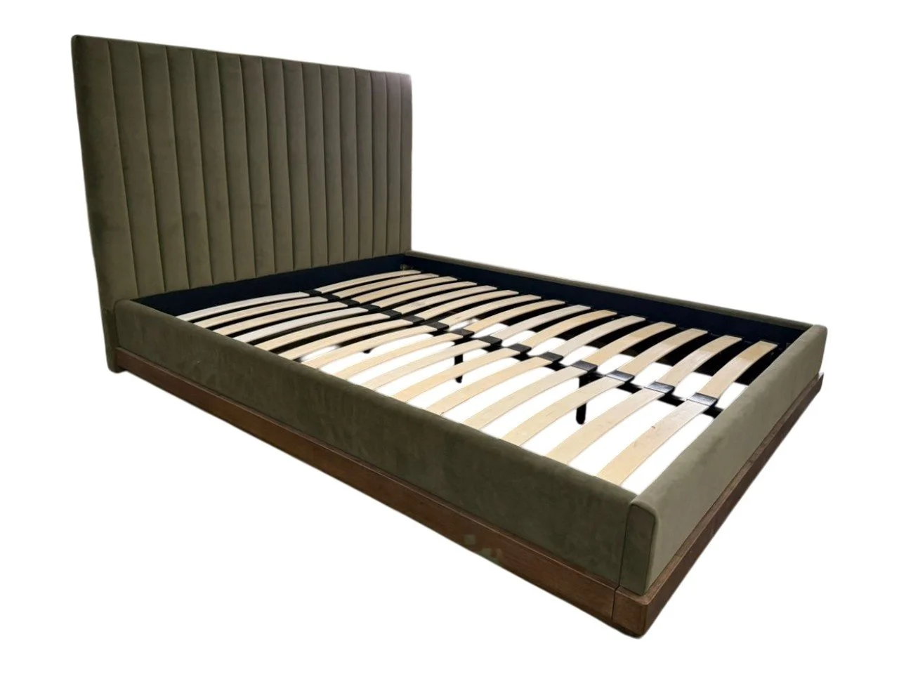 A green upholstered bed frame with a tall, vertically paneled headboard and wooden side rails, without a mattress.