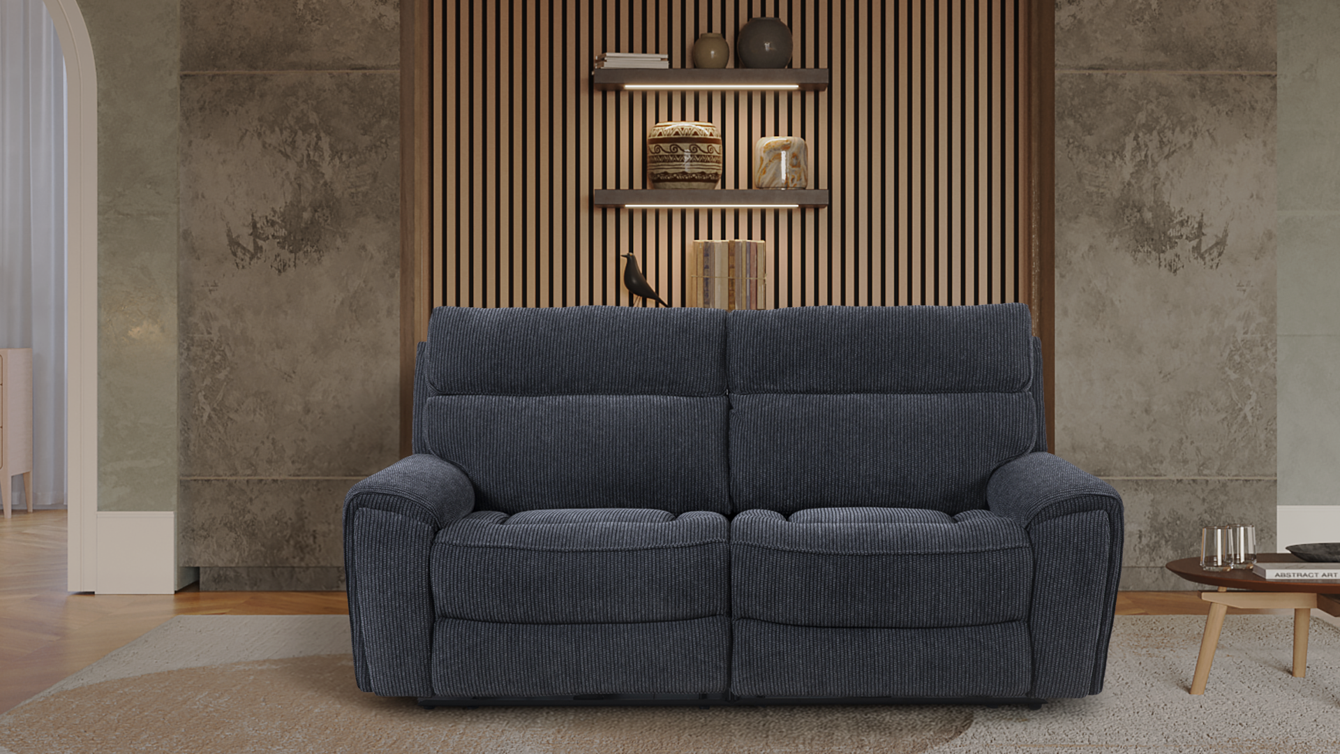 Living room with a navy blue sofa, a wooden coffee table with glasses and a book, a large abstract painting, and a wall with wooden slats and decorative vases and books on shelves.