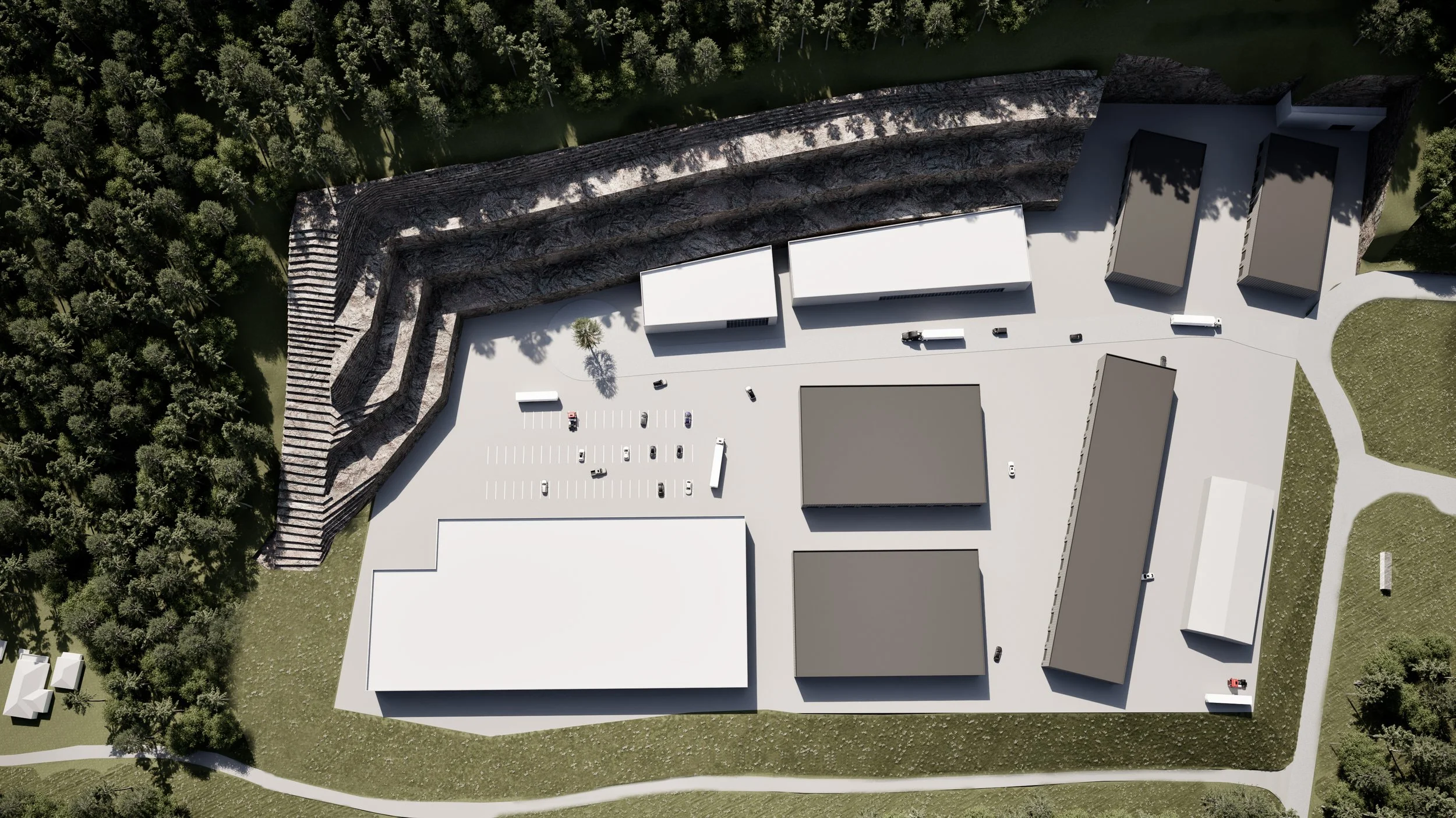 En digital visualisering av et industriområde med lagerbygninger og parkeringsplass, omgitt av skog og grøntområde.