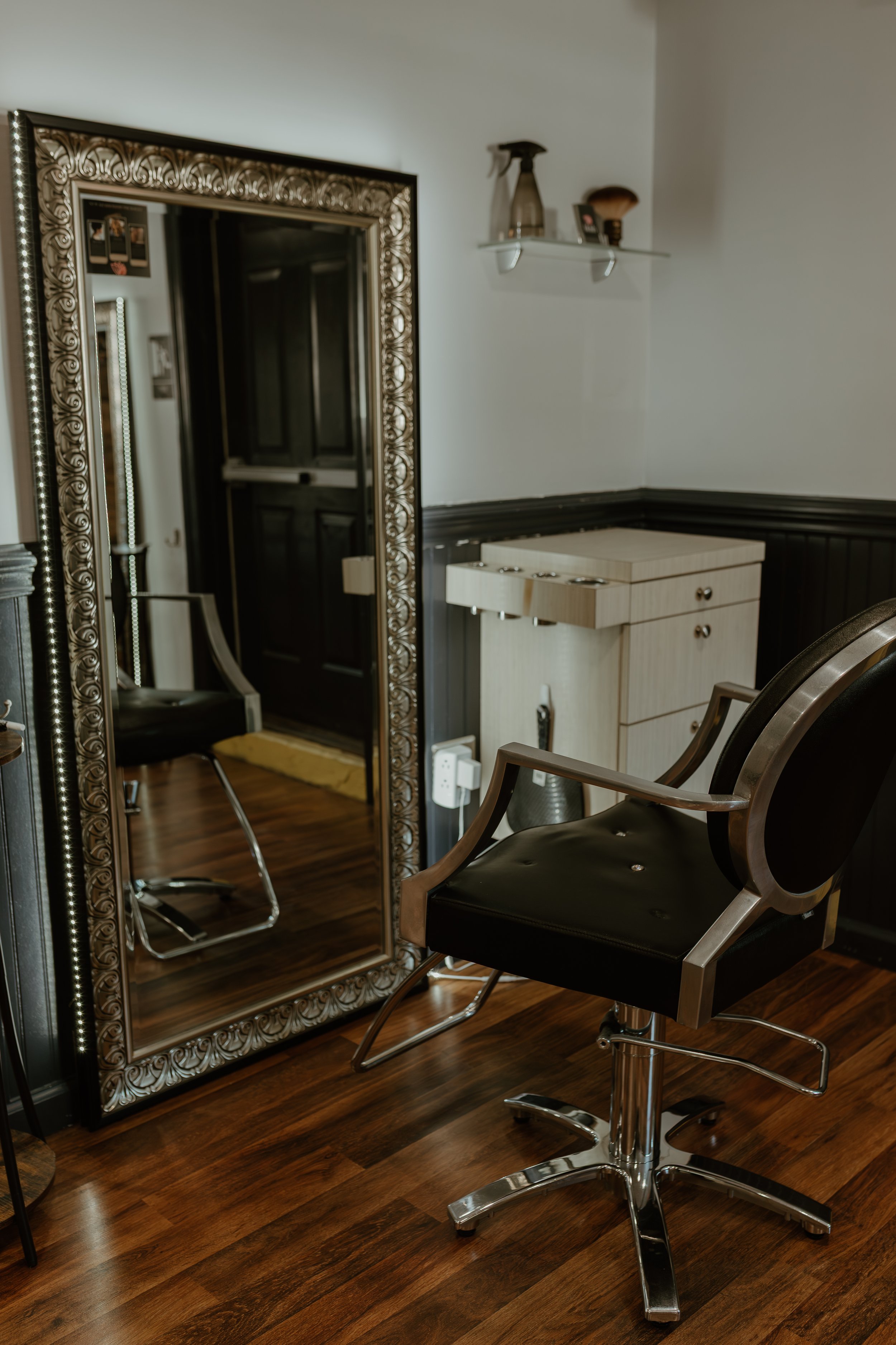 Shoulder-length brunette hair with cool-toned highlights and textured waves, styled for a modern lived-in finish.