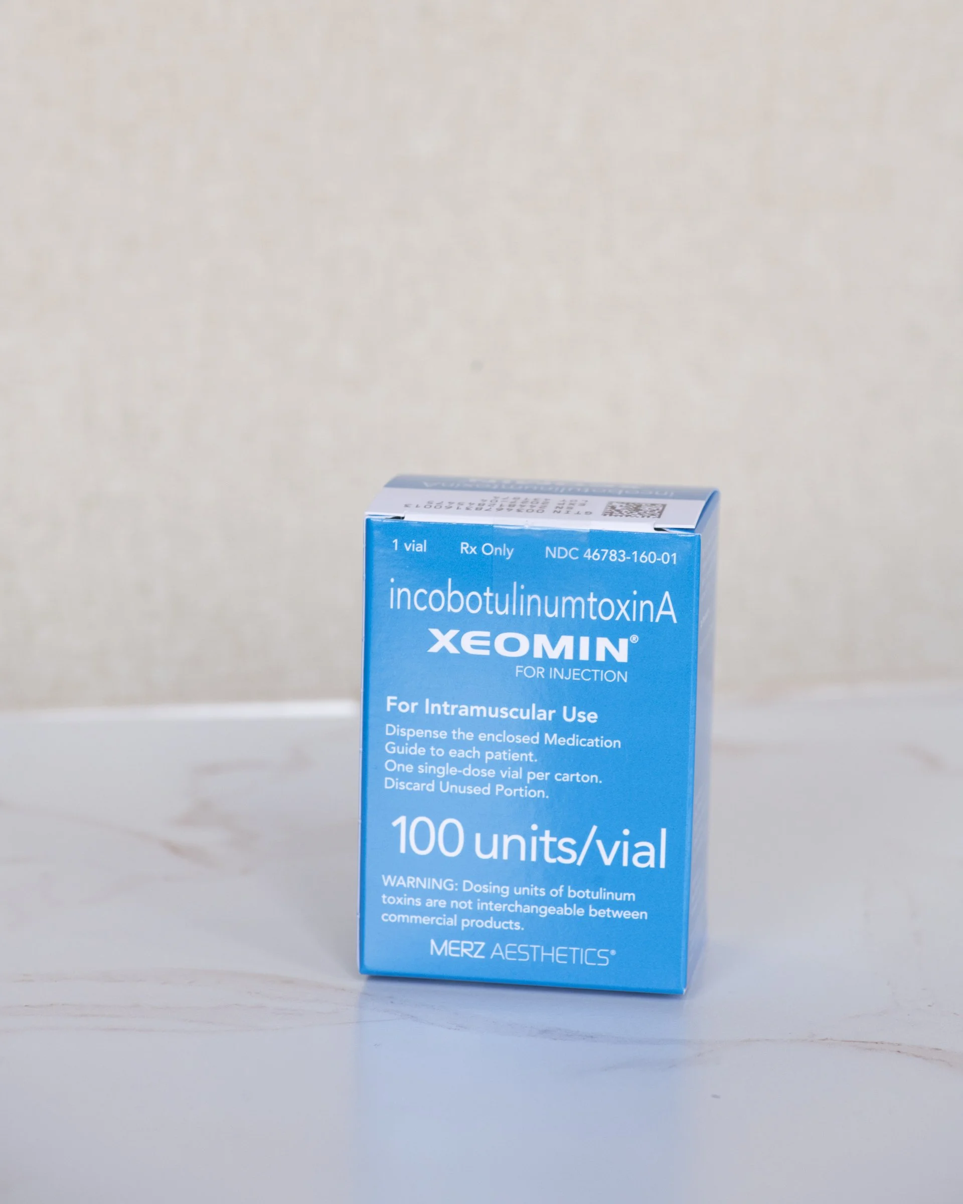 A box of incobotulinumtoxinA, a medication for intramuscular use, with instructions and warnings, displayed against a plain white background.