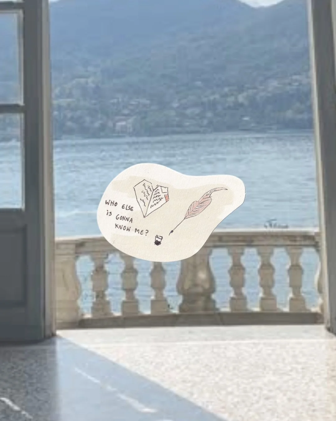 A paper with drawings of a book, a feather, and a bottle, with the text 'Who else is gonna know me?' is stuck on a window overlooking a body of water and mountains in the background.